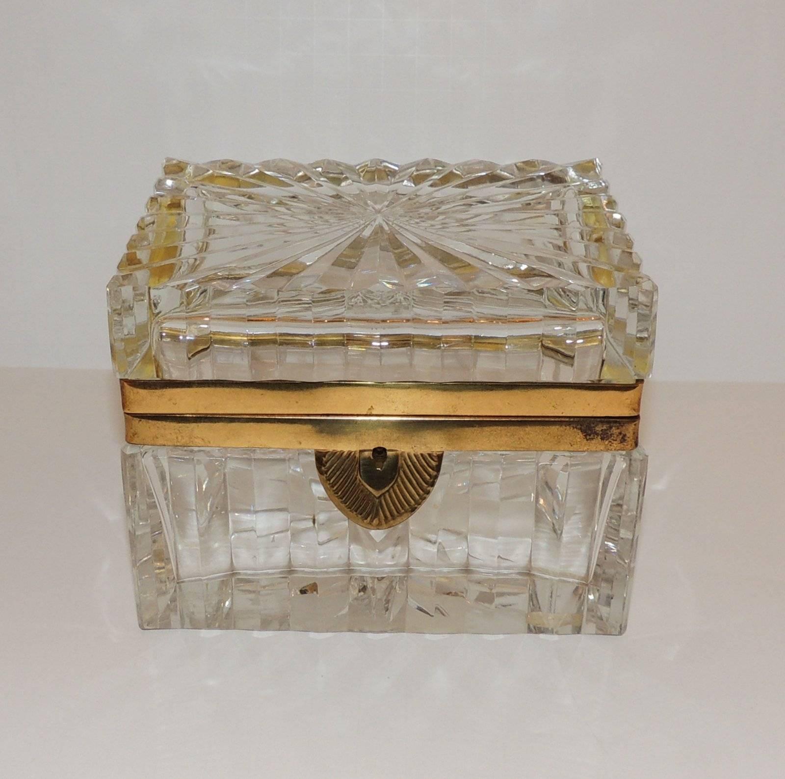 A stunning pair of French clear fluted crystal and ormolu-mounted casket with etched deco style keyhole and key.

Measures: 5.5" L x 4" D x 4.25" H

Sold separately.