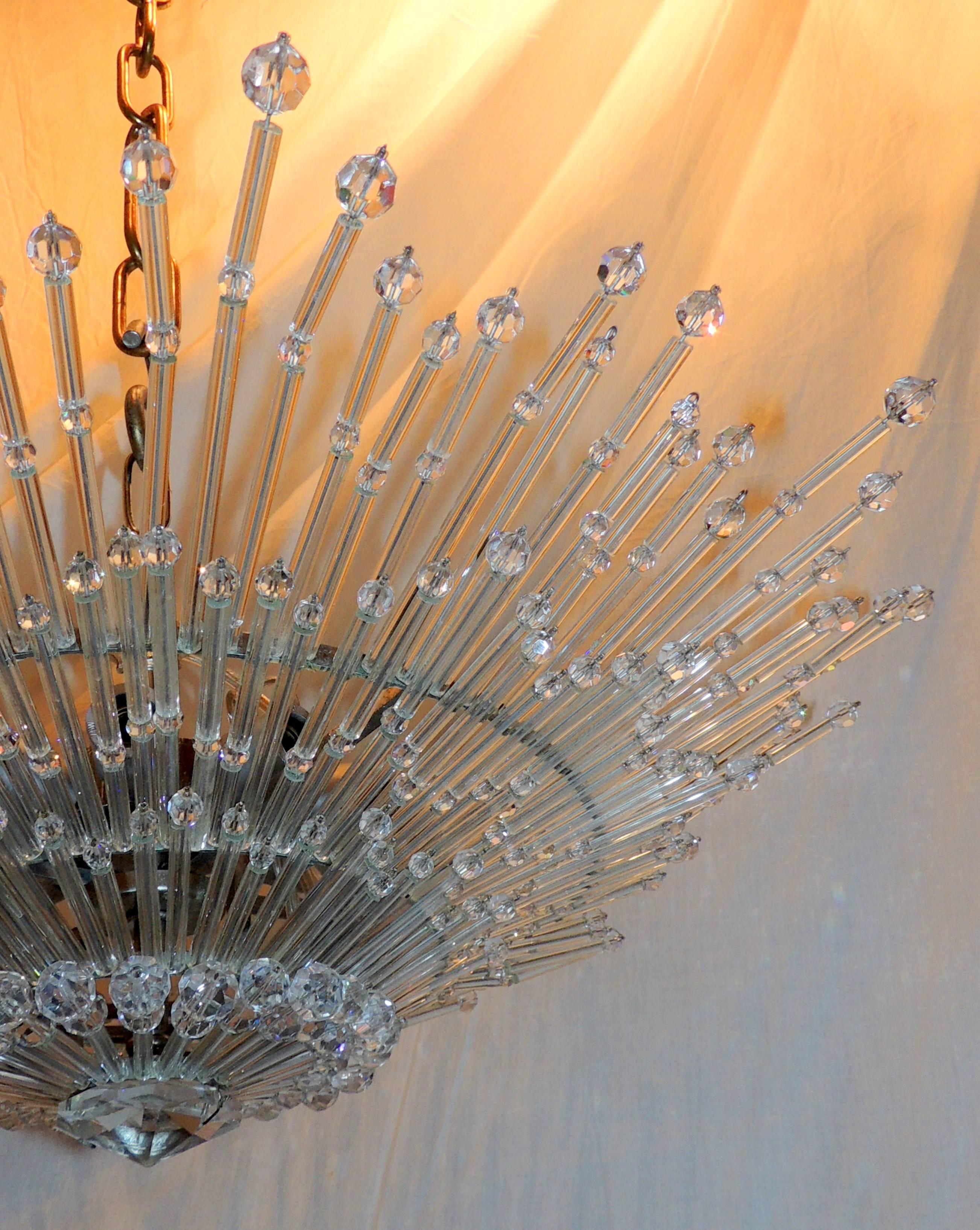 A wonderful sputnik ceiling light fixture chandelier has eight-lights (40 watts per socket) on the inside and is accented with round glass faceted beads and cylinder panels, adding a touch of glamour and whimsy. This chandelier has a polished nickel