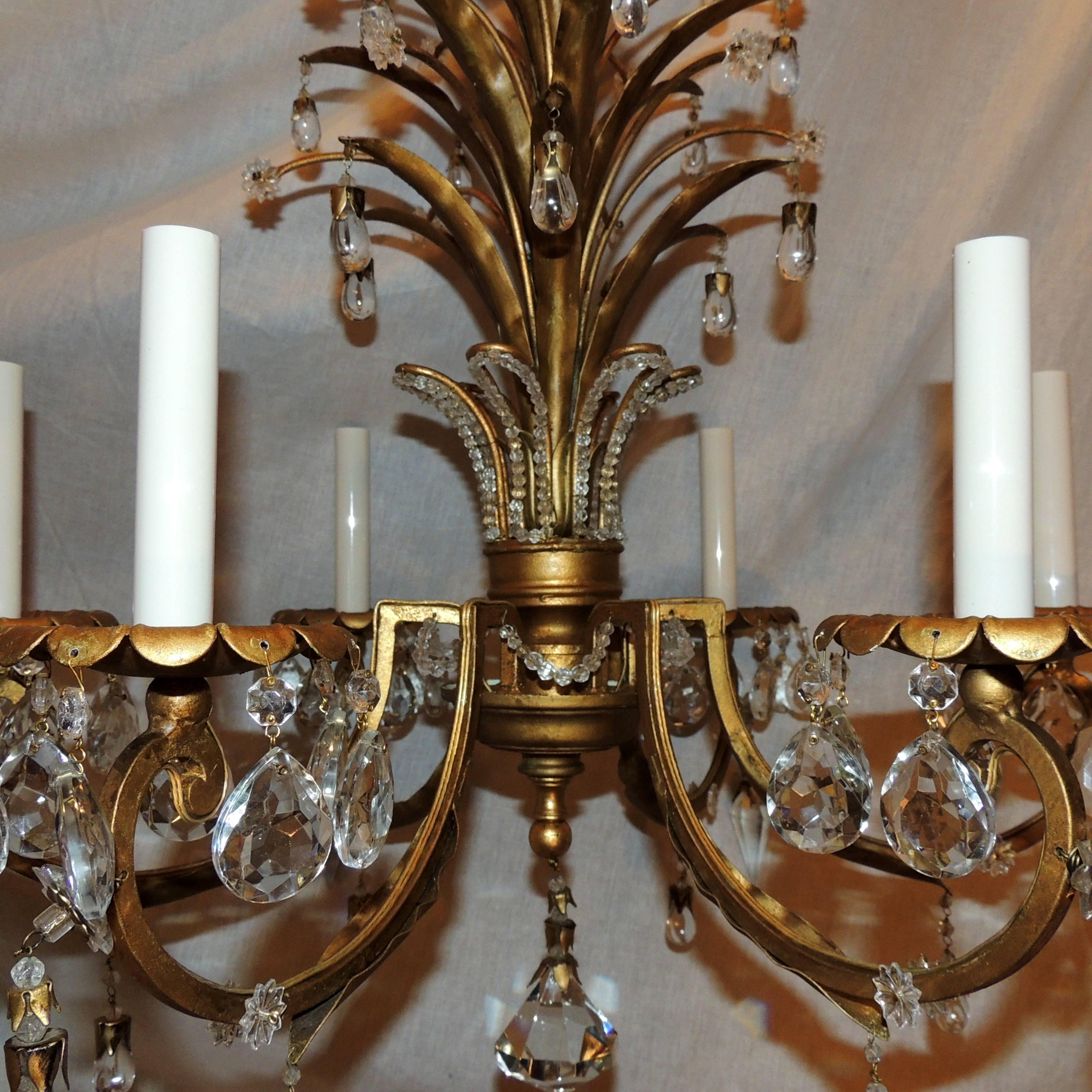 A wonderful Italian six-light gilt tole beaded fixture in the manor of Baguès with crystal tear drops and prisms, tree form chandelier in the Mid-Century feel, completely rewired and ready to enjoy.

Measures: 29" H x 24" W.
 