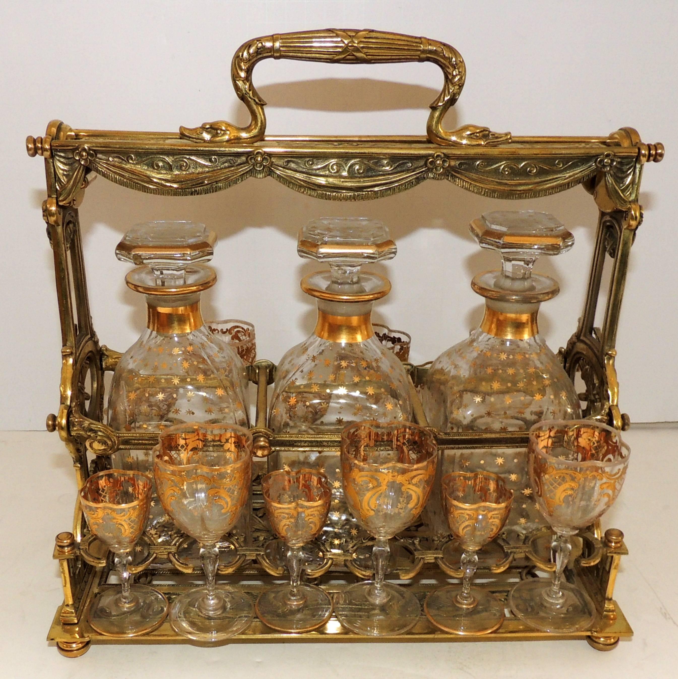 A wonderful French bronze and crystal tantalus, liquor set consisting of three decanters 8