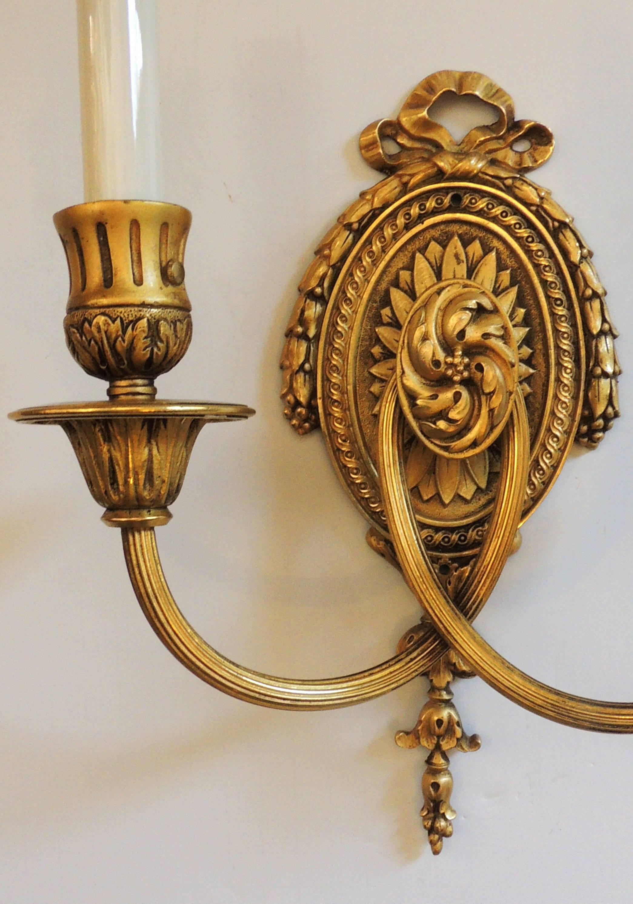 A wonderful set of four French bronze sconces in the manner of E.F. Caldwell in the neoclassical / Regency style with two-arm per socket each accepting 60 watts per socket
Completely rewired and ready to install

Sold per pair $1,850.