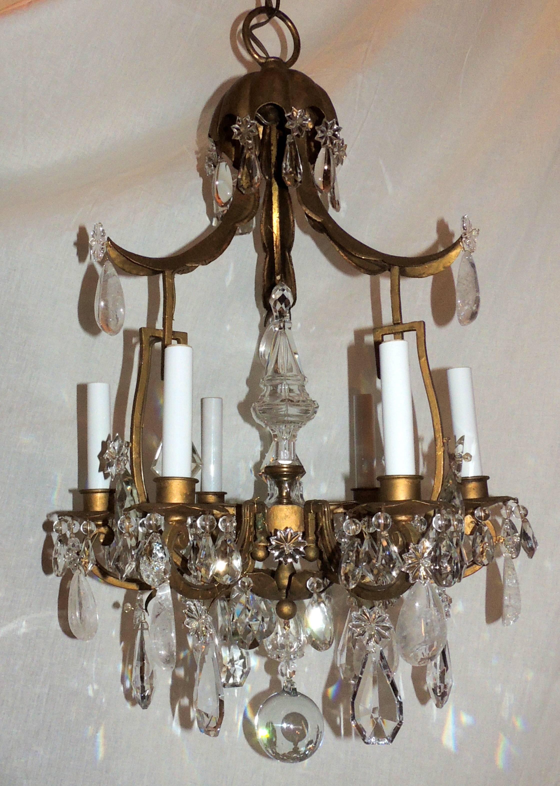 A wonderful French Pagoda form gold gilt and rock crystal Bagues style chandelier fitted with six lights each taking a max 60 watts per candelabra socket, newly wired.
Comes with chain and canopy and ready to install and enjoy.
Measures: 29