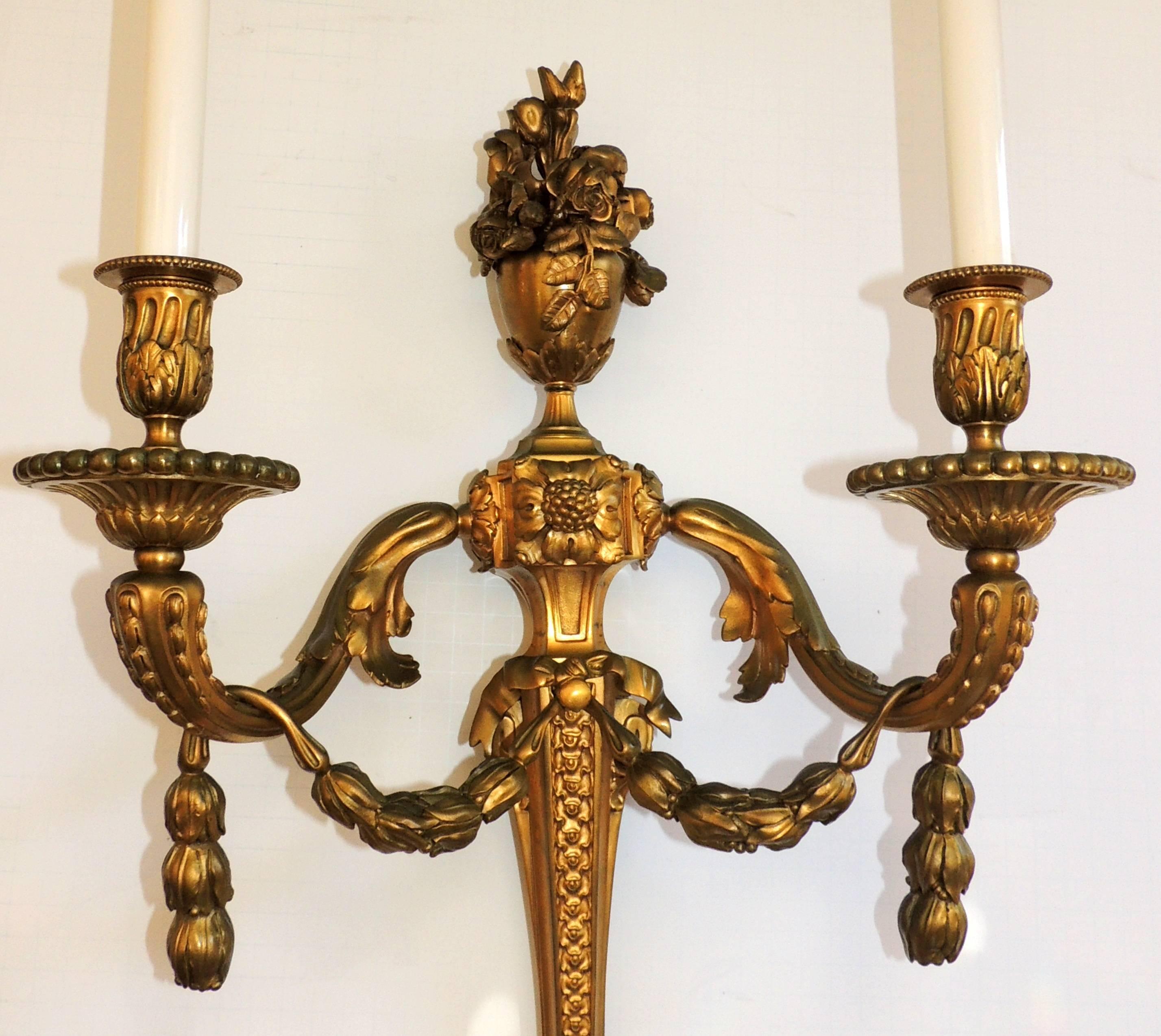 A large and wonderful pair of two-arm French doré bronze urn and floral crown top garland swag sconces, with new sockets and wires
Come with mounting hardware, ready to install and enjoy.