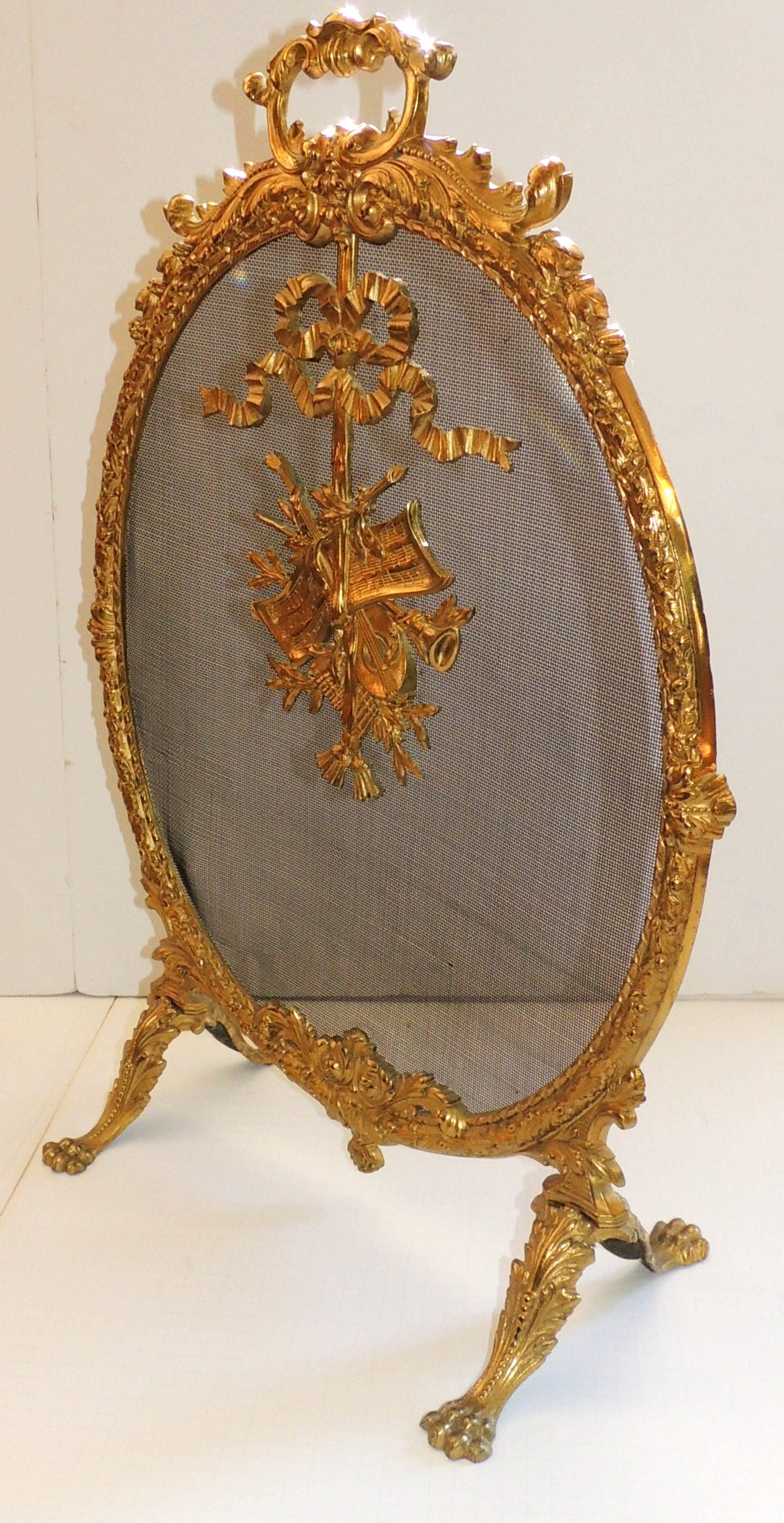 Mid-20th Century French Doré Bronze Oval Ormolu-Mounted Basket Bows Instruments Fireplace Screen