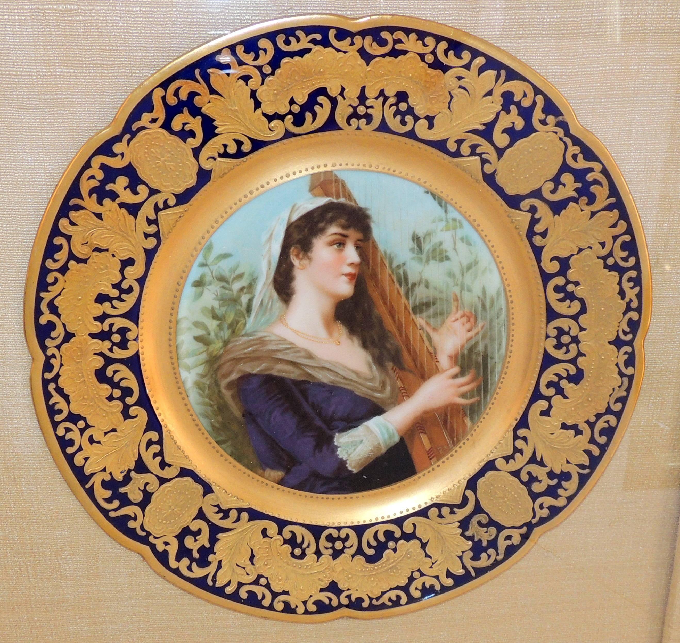A fine French hand-painted portrait plate of a female harpist by Jules Etienne Rue De Paradis, France, 1898 beautifully framed in a gold gilt shadow box frame with beige backdrop. 
Measures:
Shadow box 18