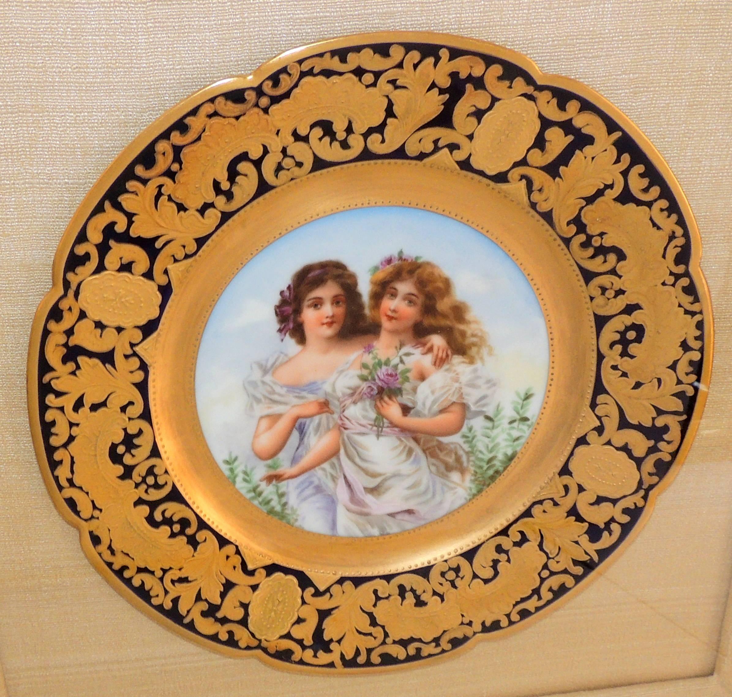 A fine French hand-painted portrait plate of two female maidens embarrassing and holding flowers
by Jules Etienne Rue De Paradis France 1898 beautifully framed in a gold gilt shadow box frame with beige backdrop.
Measures:
Shadow box 18