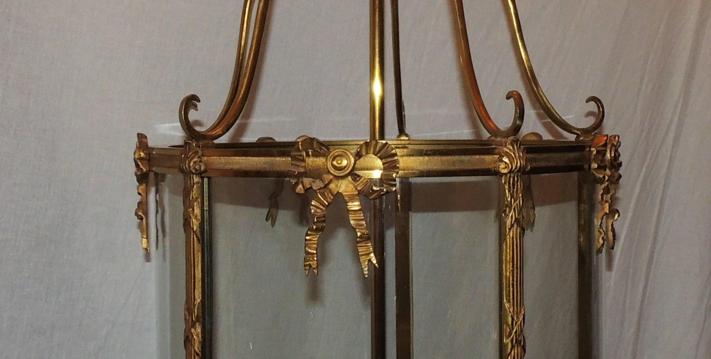 Gilt Fine Pair Doré Etched Bow Bronze Louis XVI Lantern Fixtures Curved Glass Panels For Sale