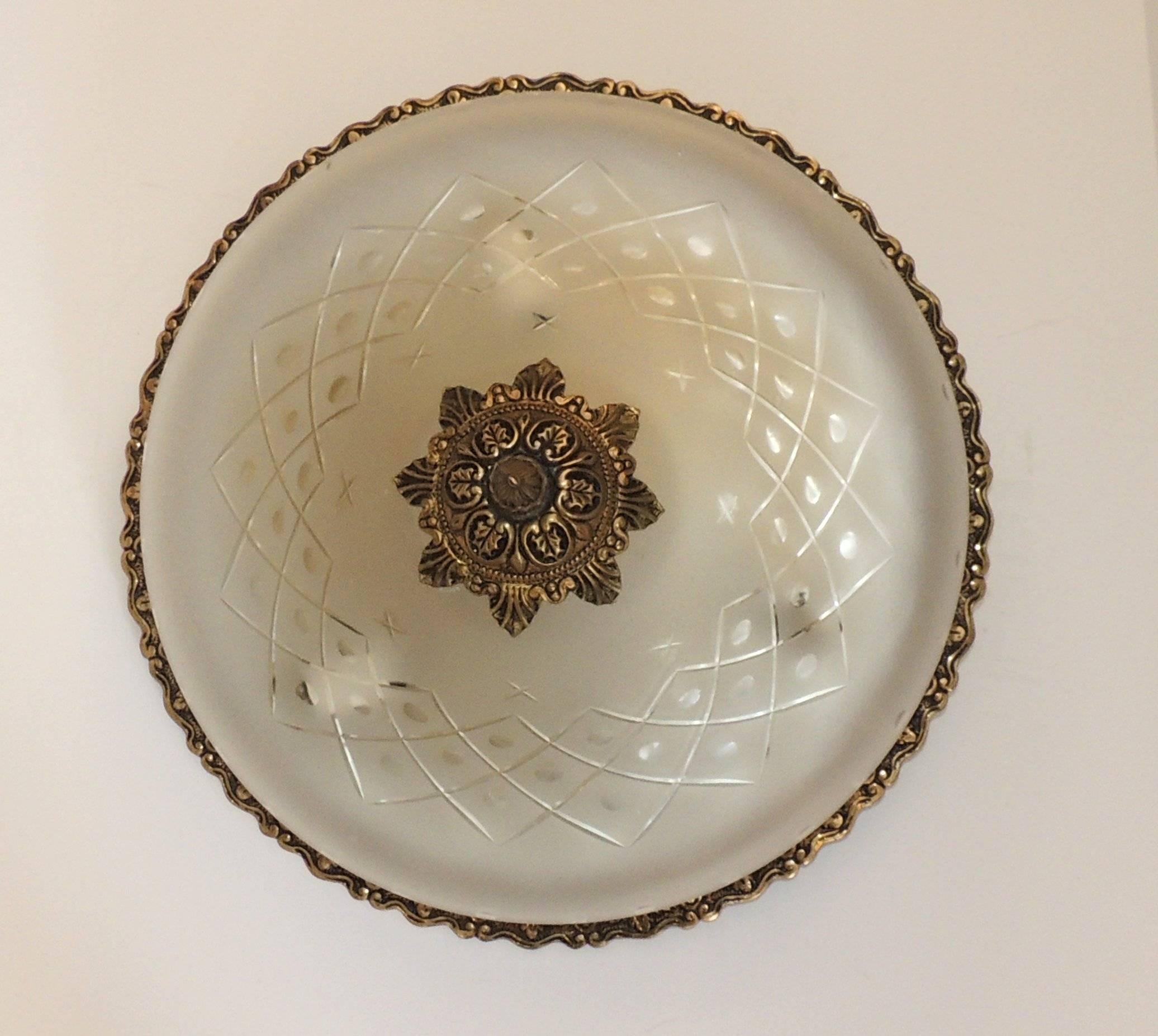 This wonderful Neoclassical bronze flush mount fixture with the cut-glass stars on the frosted glass will give off a very soft and pretty light to your space. The antiqued bronze finish is beautifully done in a graduated filigree trim around the