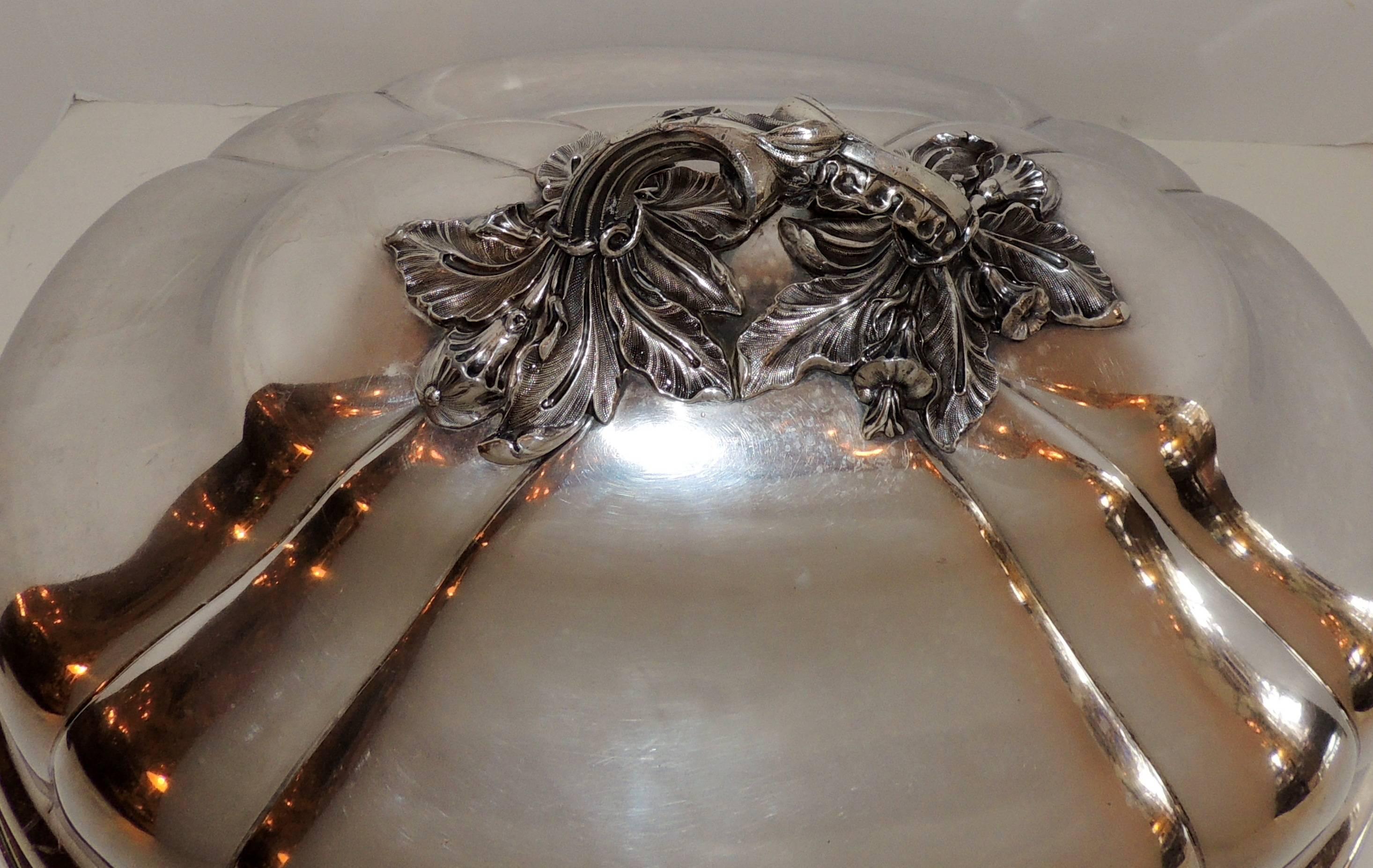 A rare and wonderful silver plated extra large antique serving meat food turkey dome / cover, in the Victorian style with a beautiful intricate handle. Finished with a wonderful lion crest on one side.