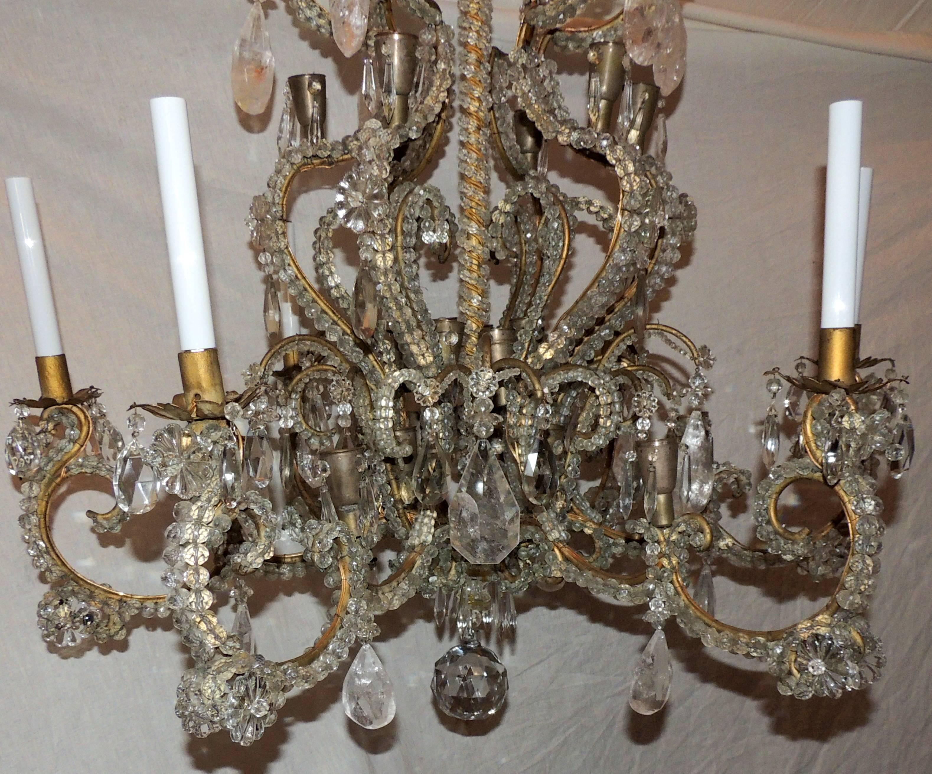A wonderful large french bronze and beaded crystal with rock crystal accents in the manner of Maison Bagues with 6 arms and 36 lights in total this chandelier will light up any room in your home with elegance.