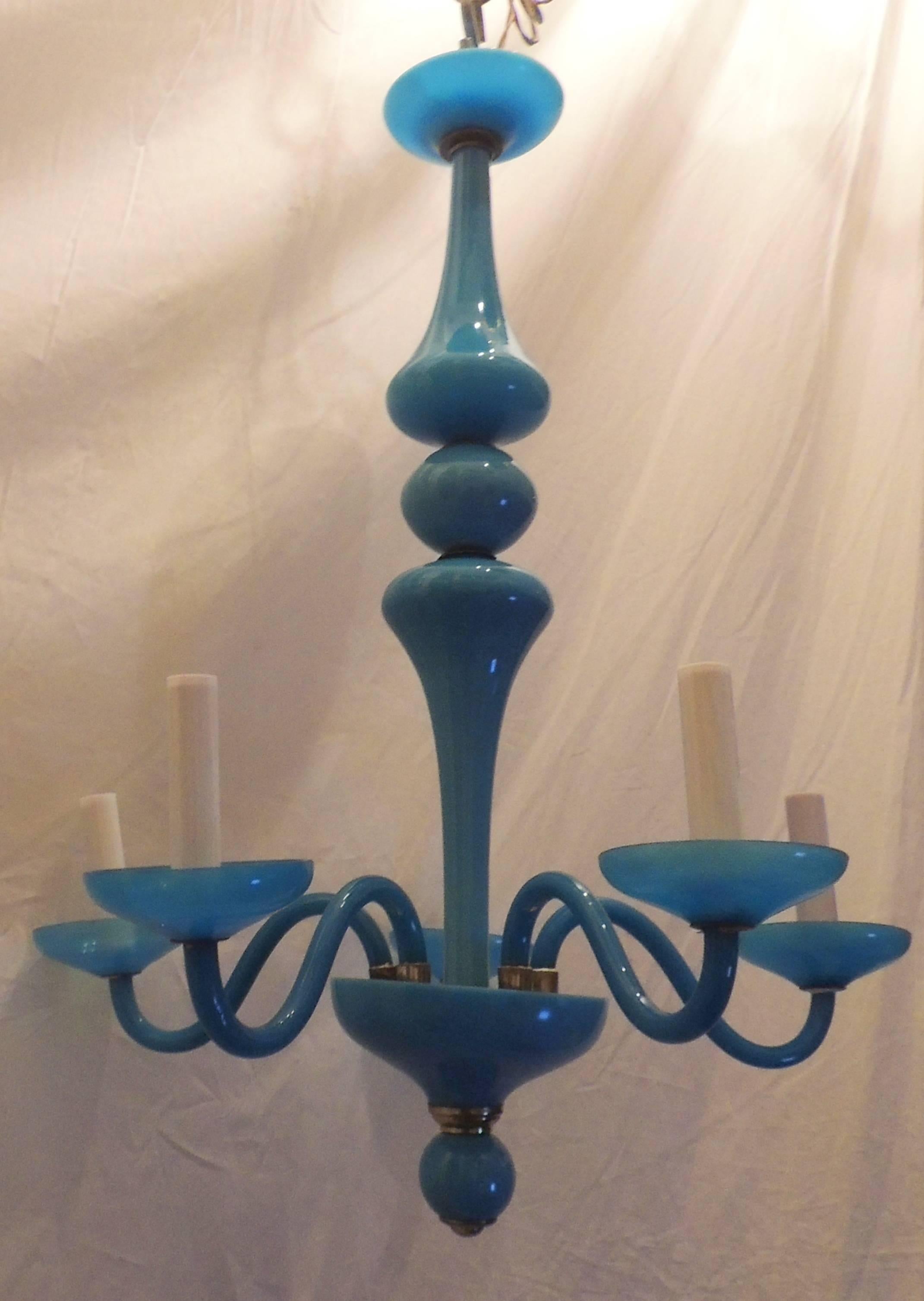 A wonderful French blue opaline glass and brass chandelier with five candelabra lights with a max 60 watts per socket.
