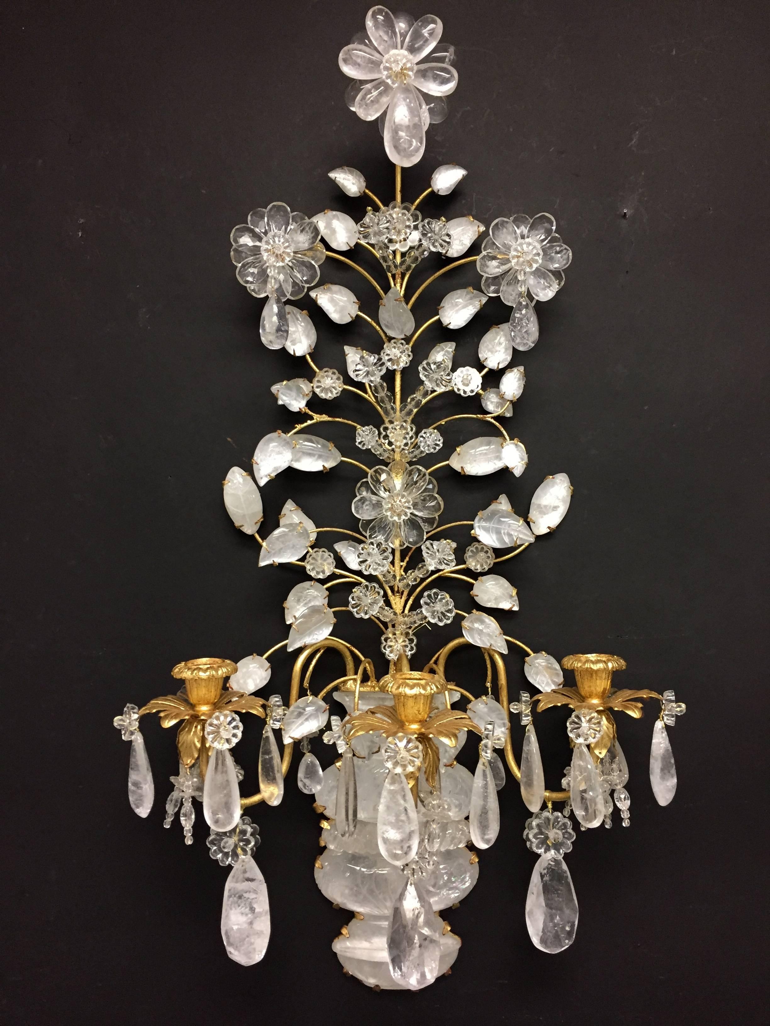 A beautiful pair of gold gilt and carved rock crystal three-arm Baguès / Jansen style wall sconces
Wiring is available.