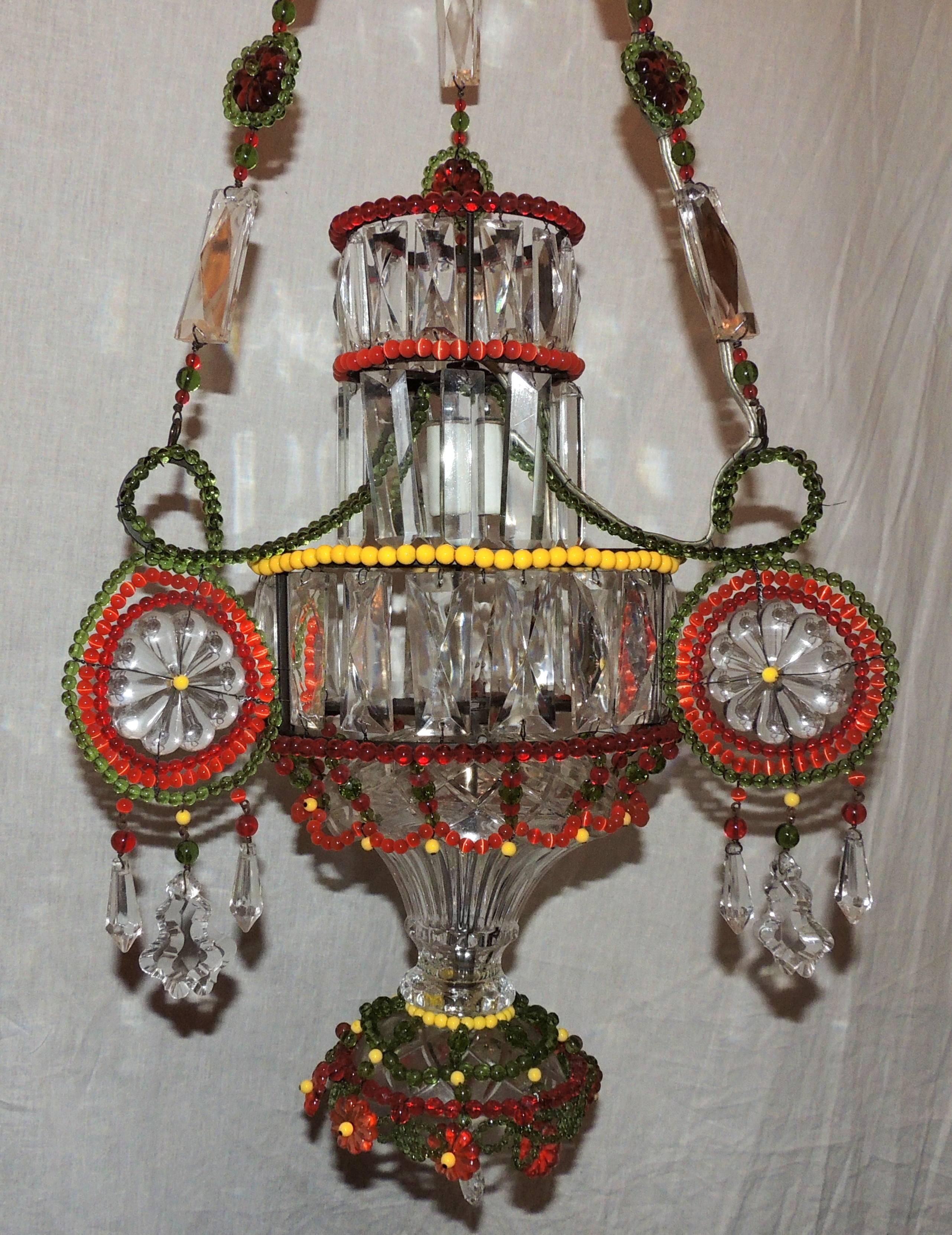 A wonderful pair of multicolored beaded and crystal pendent single light chandelier fixture.
The height is adjustable to your needs.
Sold separately.