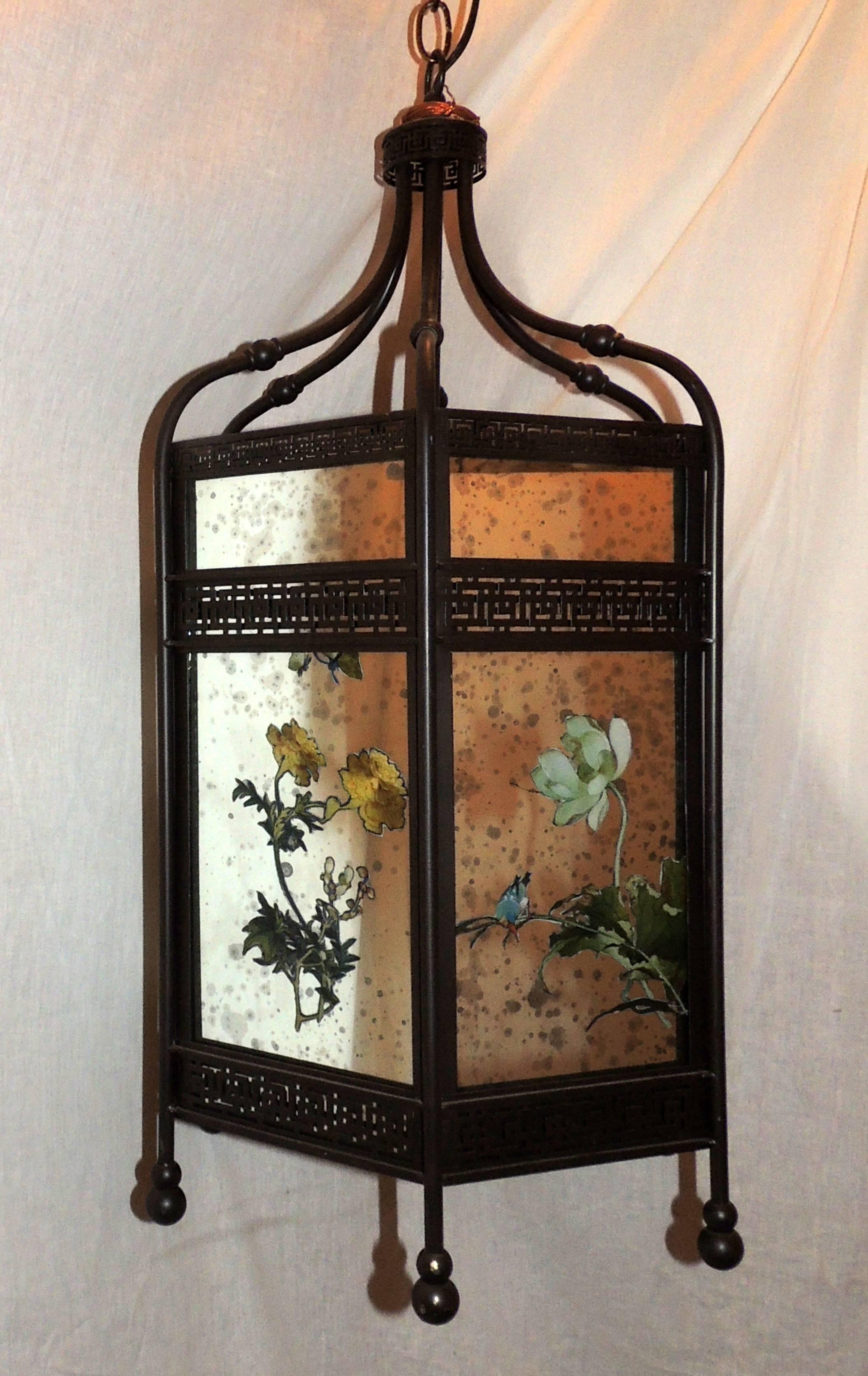 A wonderful chinoiserie octagonal mirrored and reverse hand-painted patinated lantern pendent with three candelabra lights

