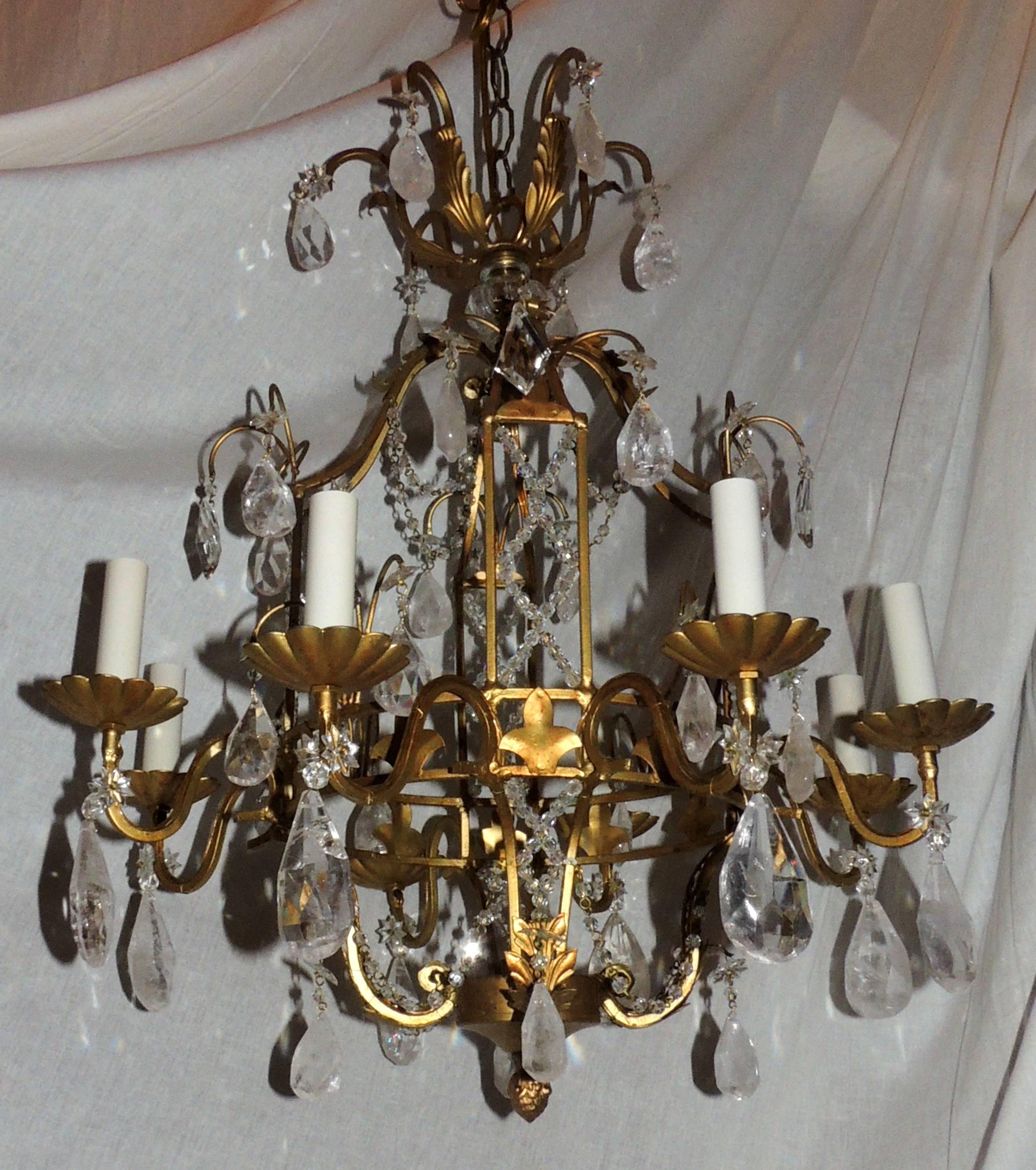 A wonderful French Bagues style, beaded lattice and rock crystal gold gilt pagoda form eight-light chandelier. Completely rewired and ready to enjoy with canopy and all mounting hardware.