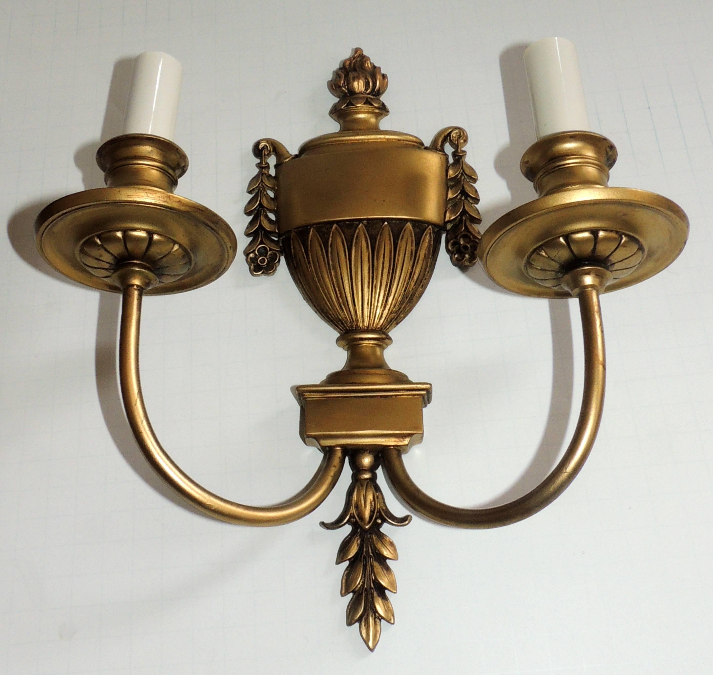 Wonderful Regency neoclassical pair of urn form and gilt bronze Empire style E.F. Caldwell two light wall sconces. Rewired with new sockets and ready to enjoy.