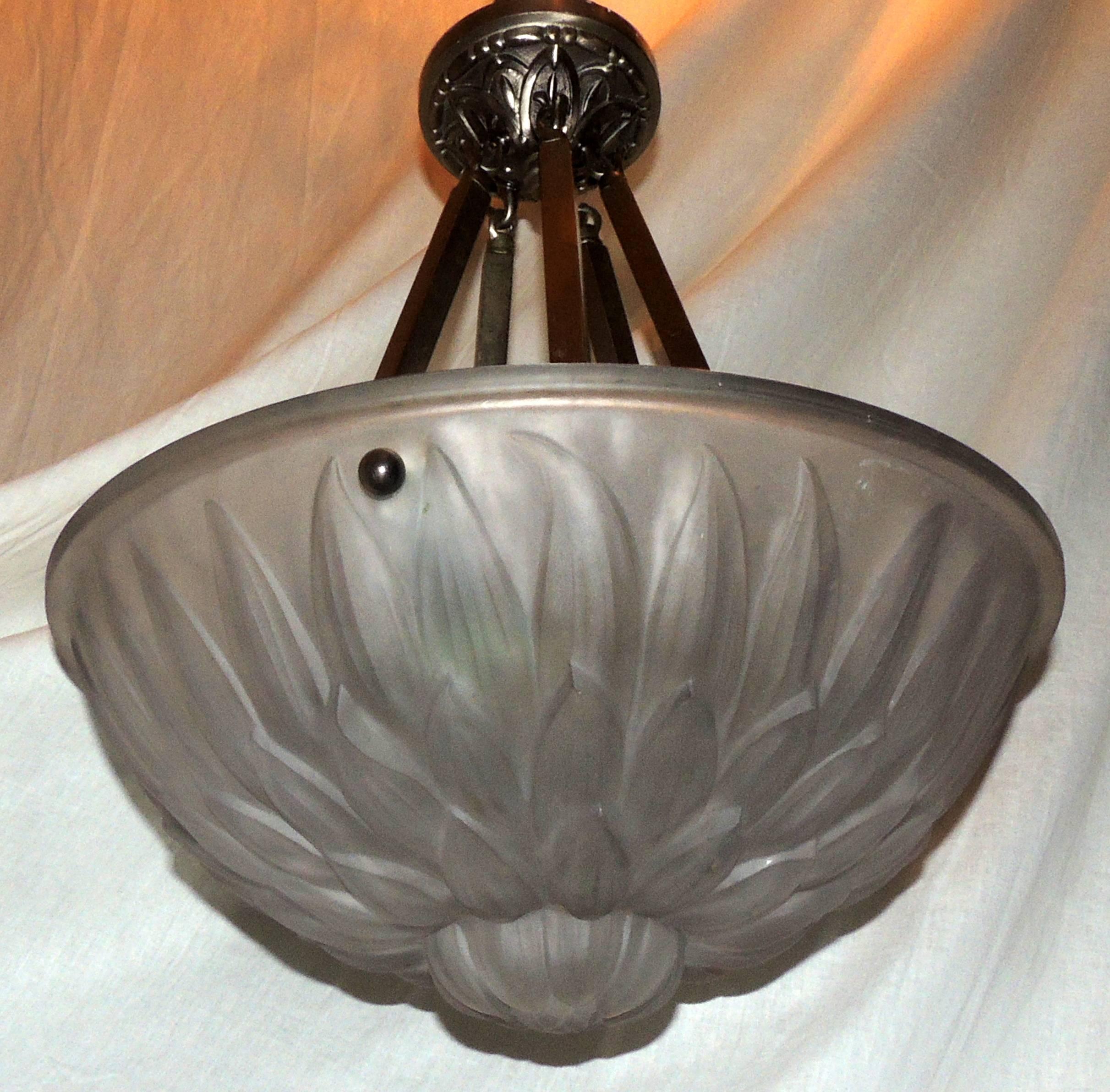 A wonderful French art deco frosted glass and brushed nickel bronze flower form three-light semi /hanging fixture.
Rewired and ready to install with mounting hardware included.