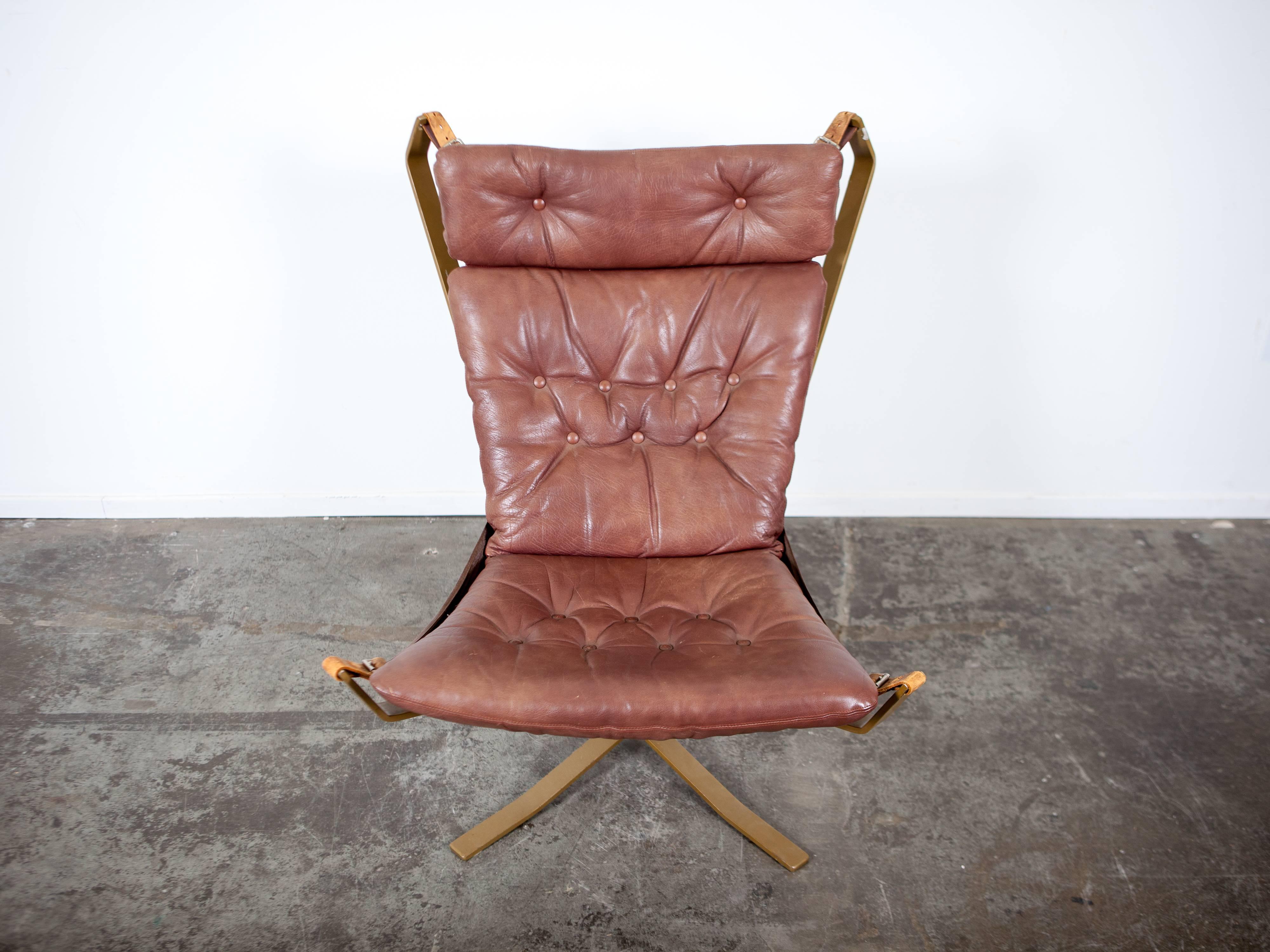 Danish furniture maker made 'Falcon' style tall back chair with metal frame and original leather cushion.  The metal is bronzed and the original leather cushion straps are intact. It was Denmark's 'version' of the Sigurd Ressell Falcon chair. 