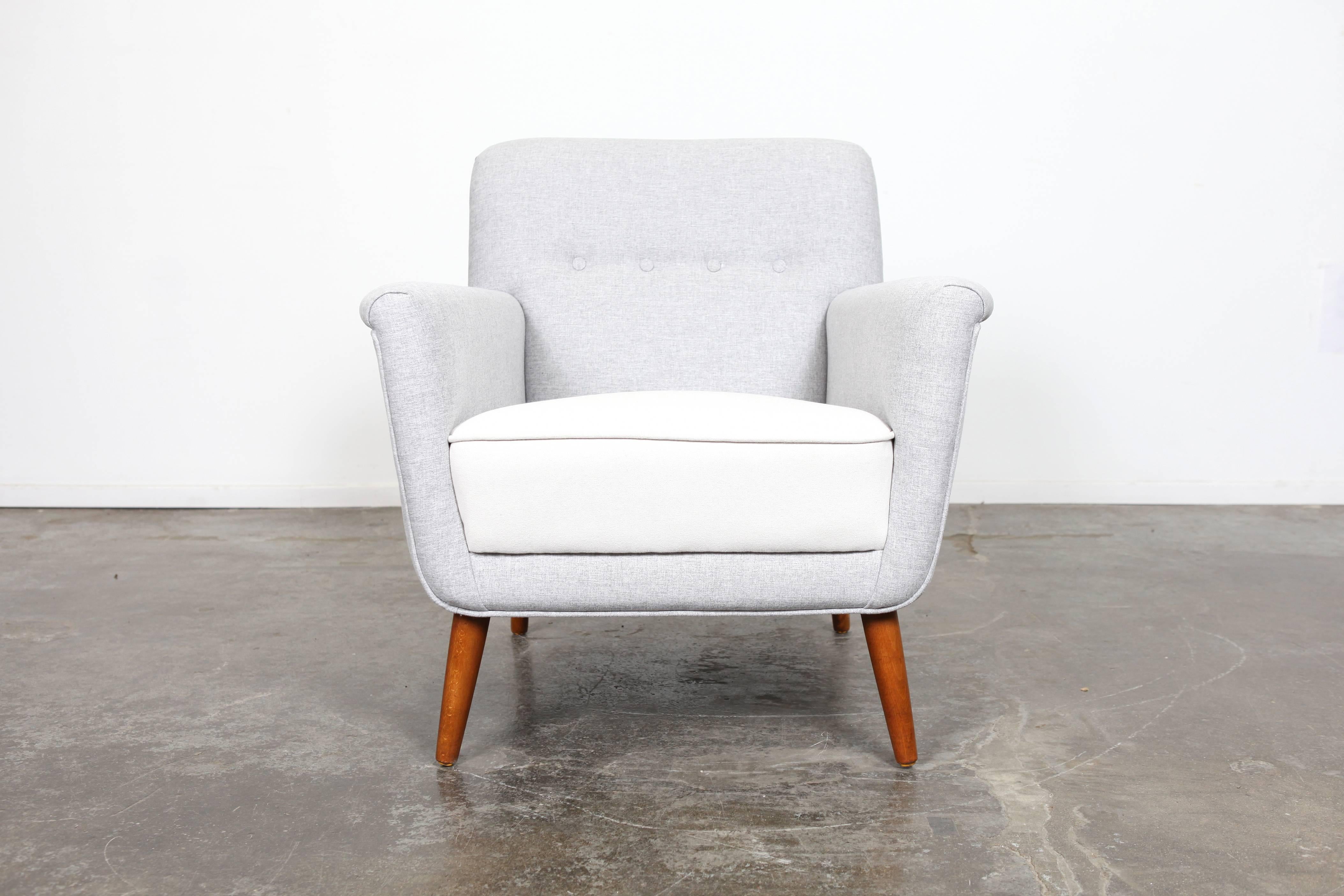 Danish Mid-Century Modern tufted lounge chair with tight back and seat, newly upholstered.