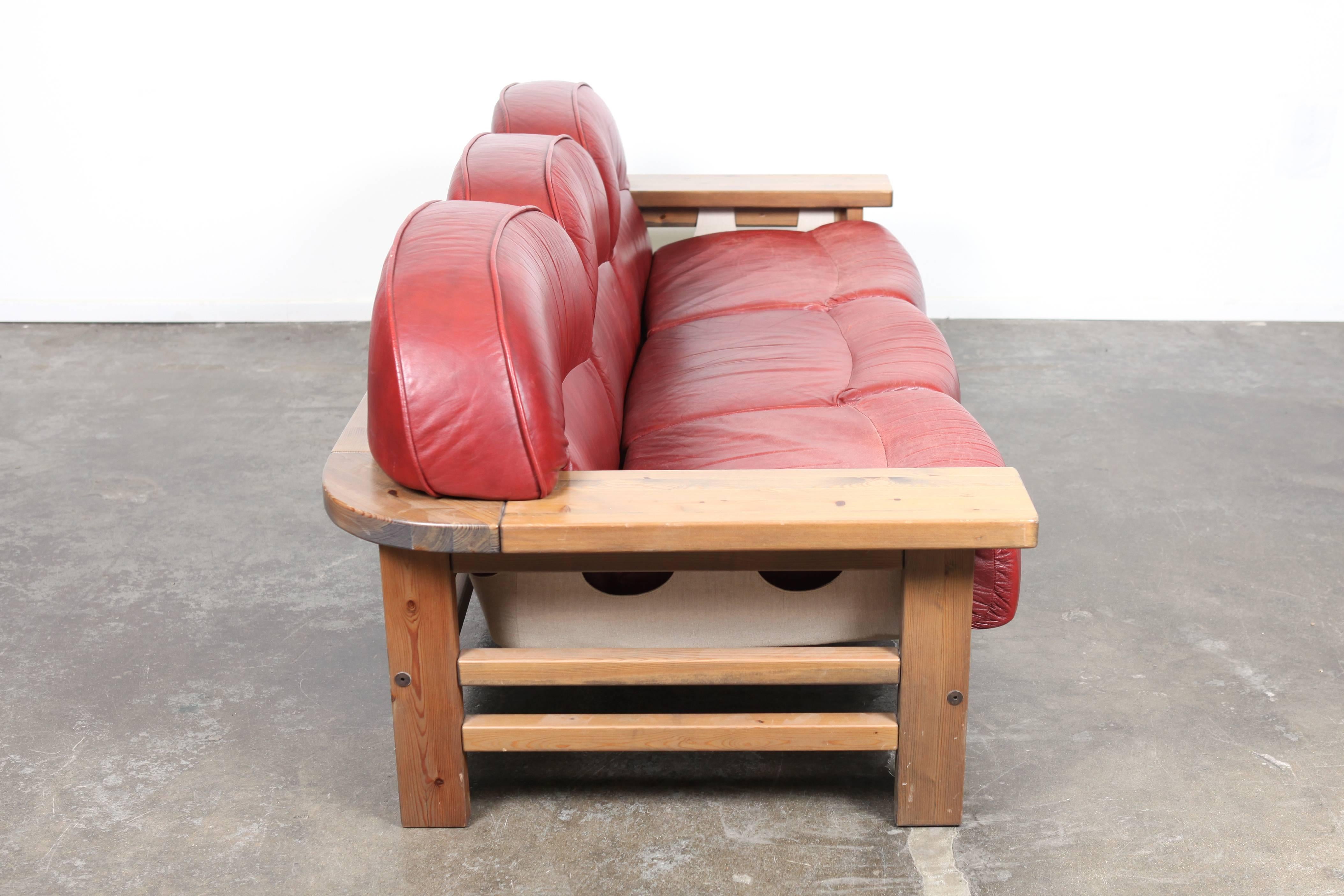 red mid century sofa