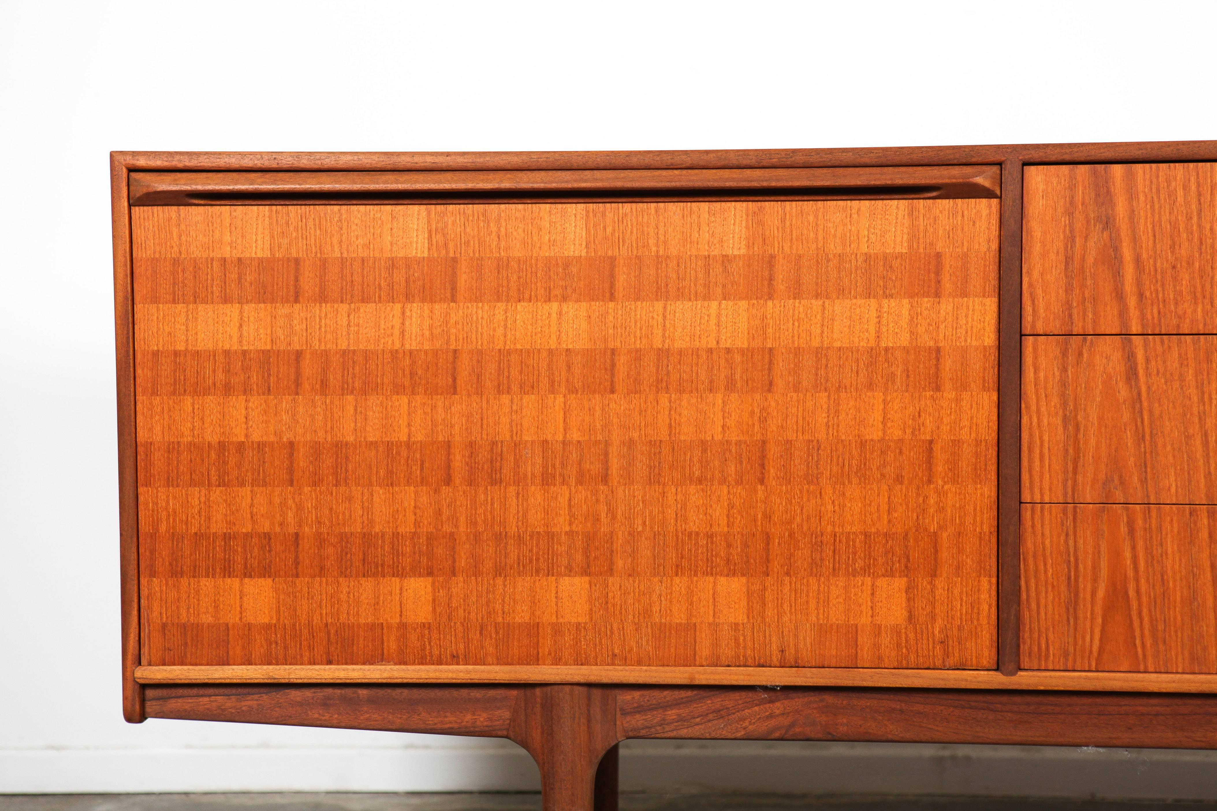 Teak Mid-Century Modern sideboard by McIntosh, rare model with beautiful patterned inlay on the doors and three circular drawer handles.