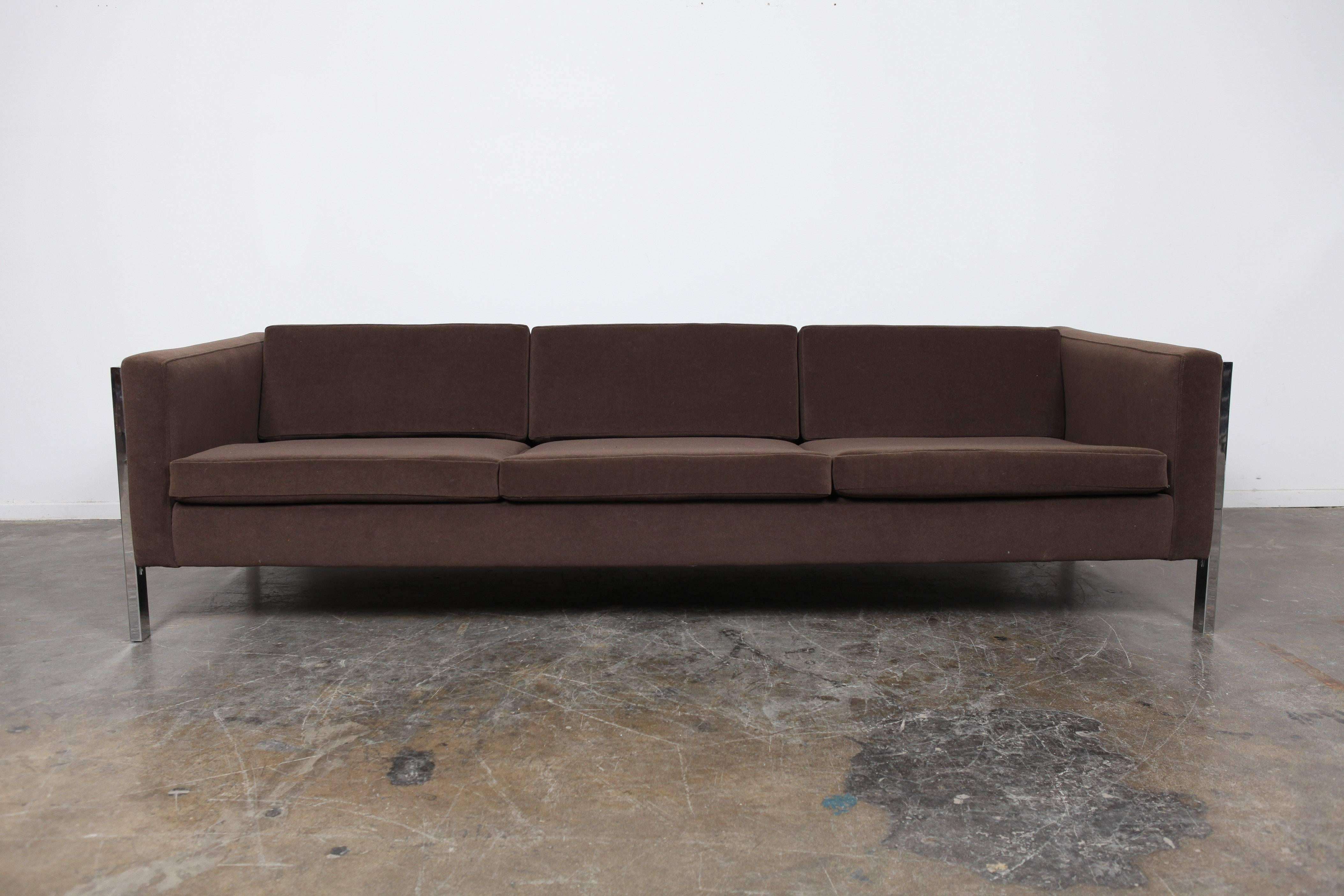 Chrome framed American Mid-Century Modern three seat sofa with loose cushions, newly upholstered in a chocolate brown mohair/velvet fabric. Similar in style to Milo Baughman, but designer unknown. Made by Forecast.