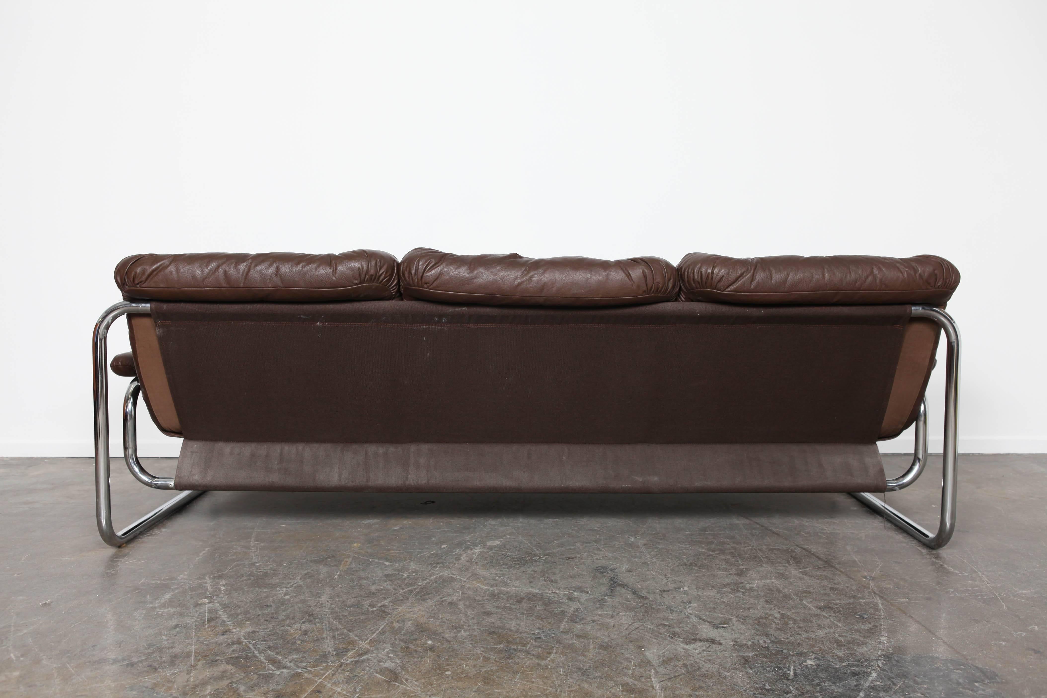 Mid-Century Modern Three-Seat Brown Leather Tufted Sofa on Chrome Frame by Johann Bertil Häggström