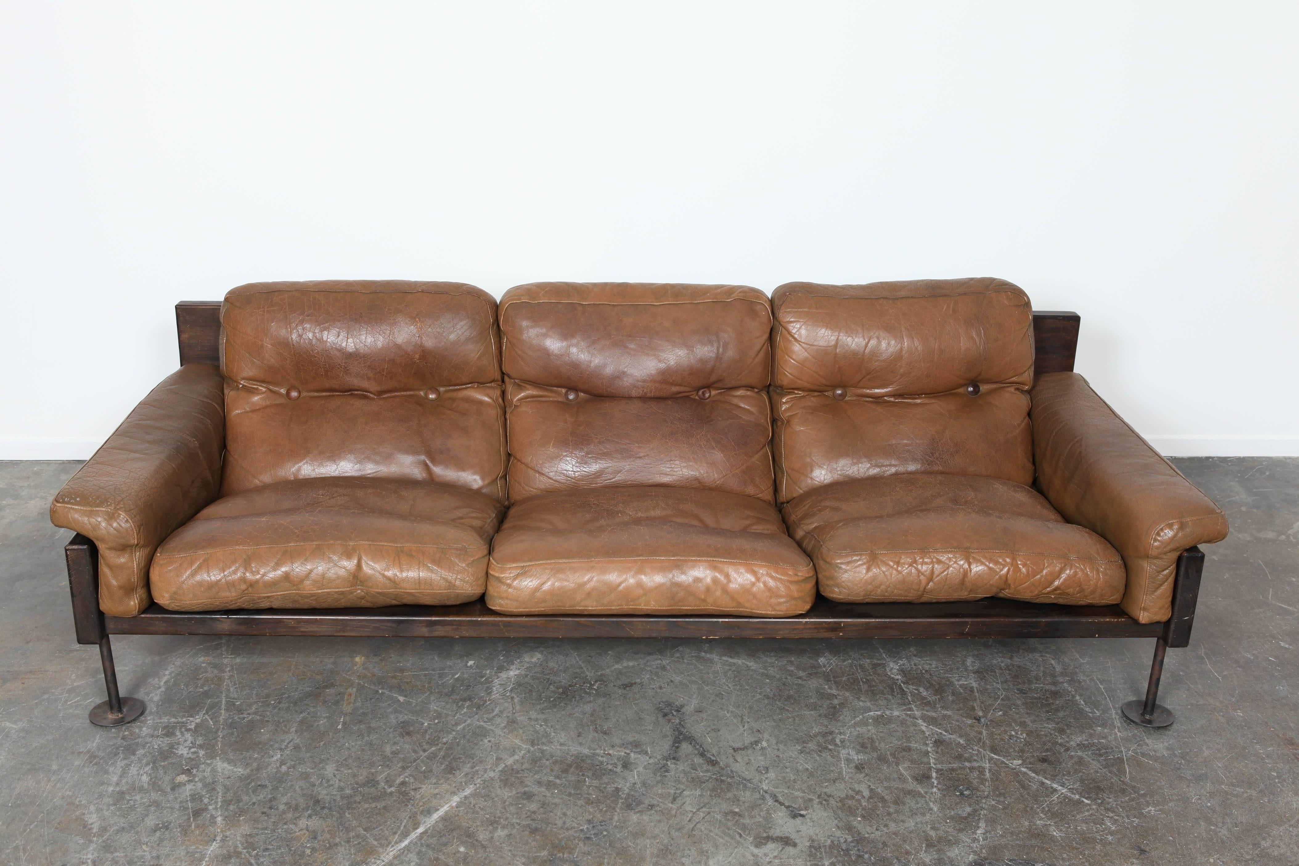 Brown leather three-seat sofa by Hannu Jyräs, Finland. Pine frame, and metal legs. Original leather.
 