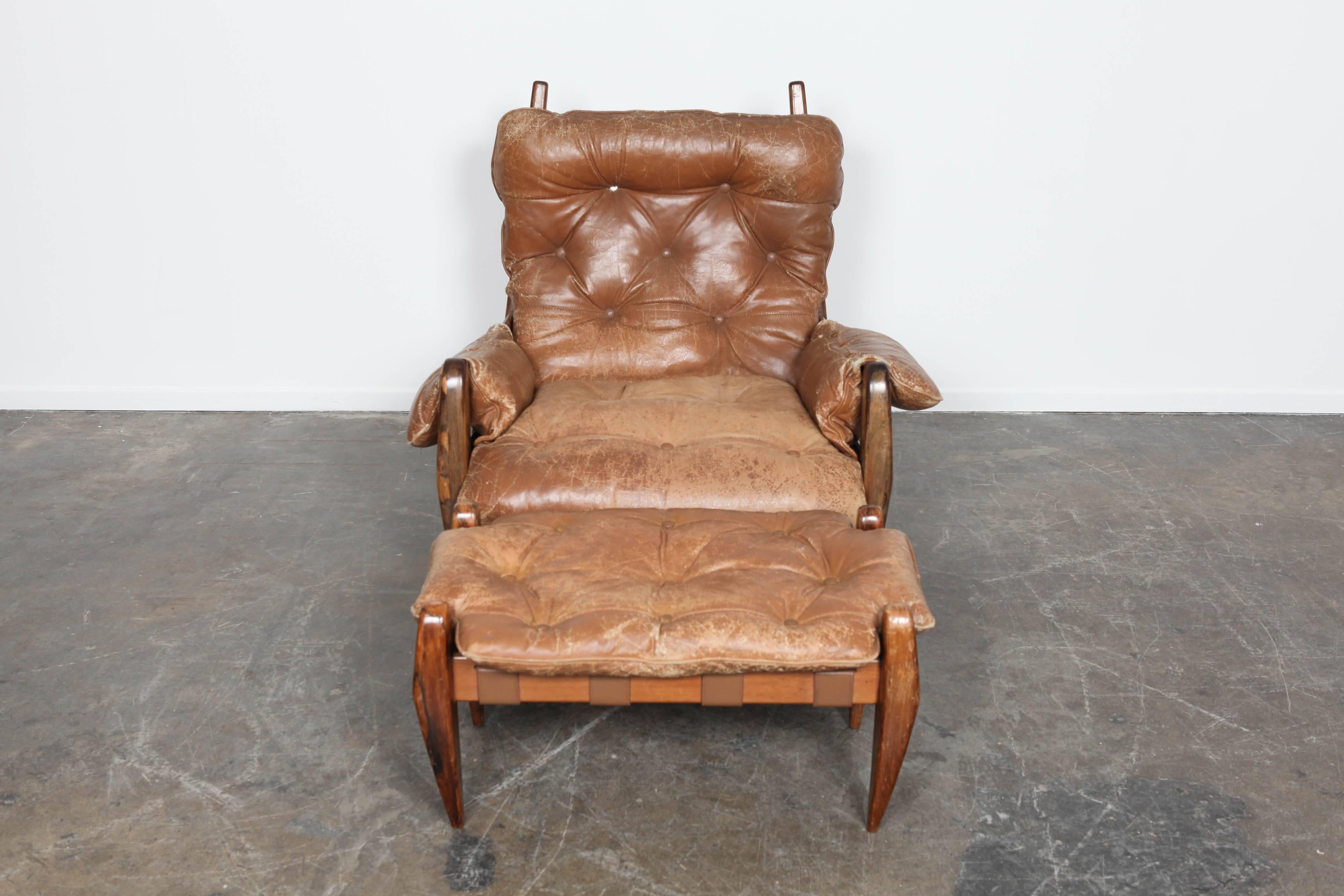 Jacaranda rosewood chair with ottoman by Jean Gillon. Made in Brazil, circa 1960s. Original tan leather upholster.
 