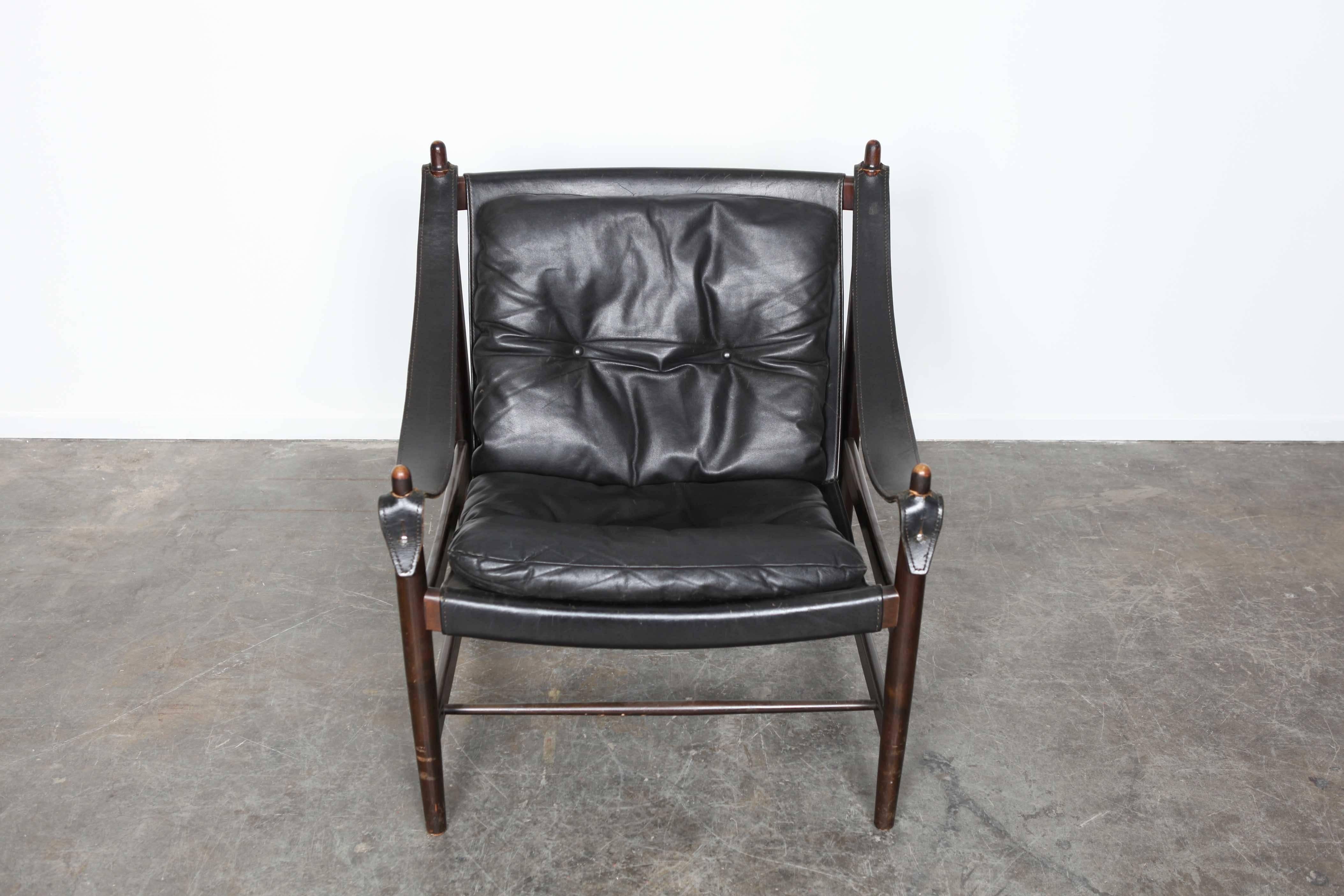 Black leather safari chair with leather armrests. Wood frame with all original leather.