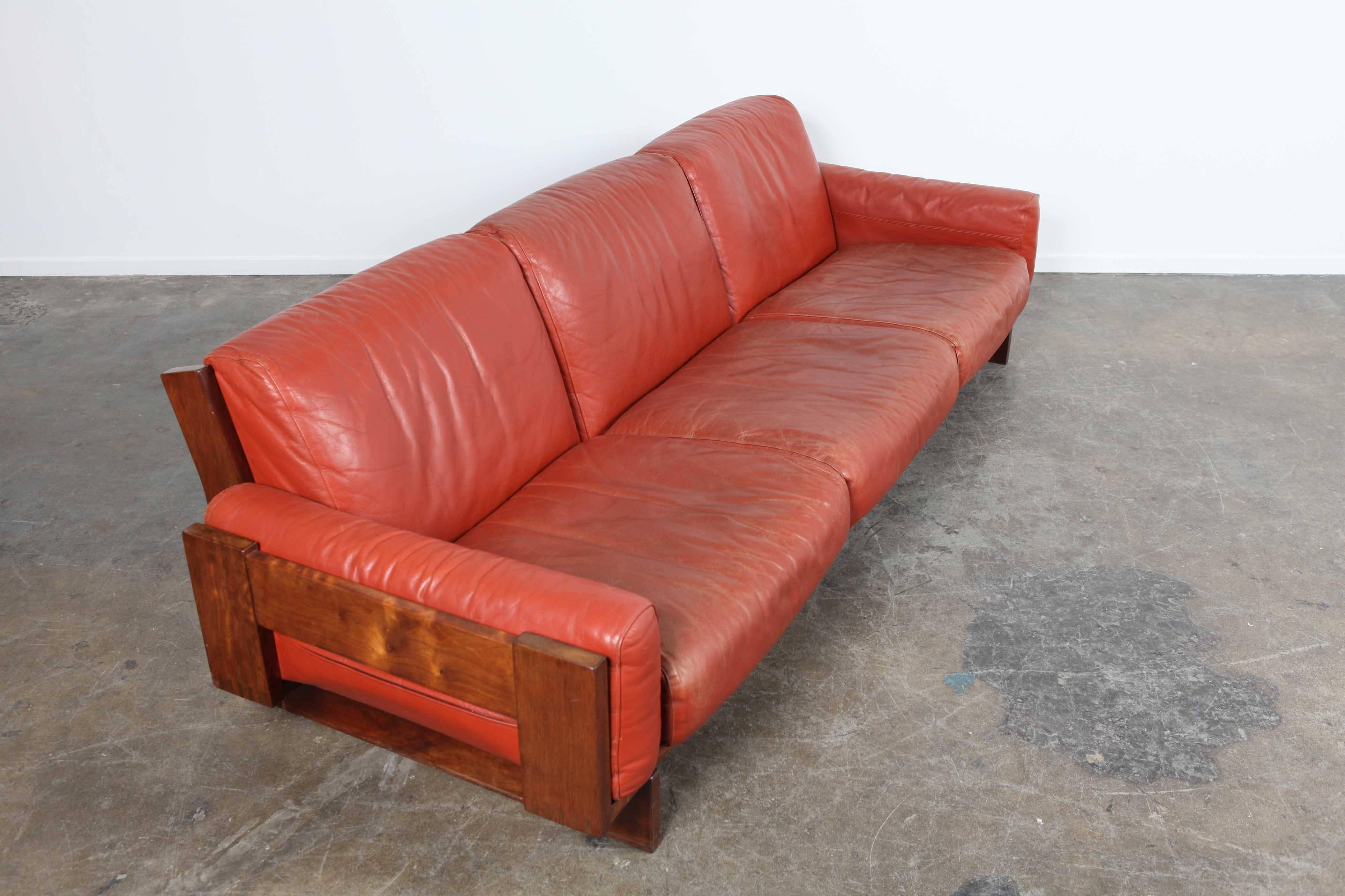 Red leather, three-seat sofa by Torbjørn Afdal of Norway.