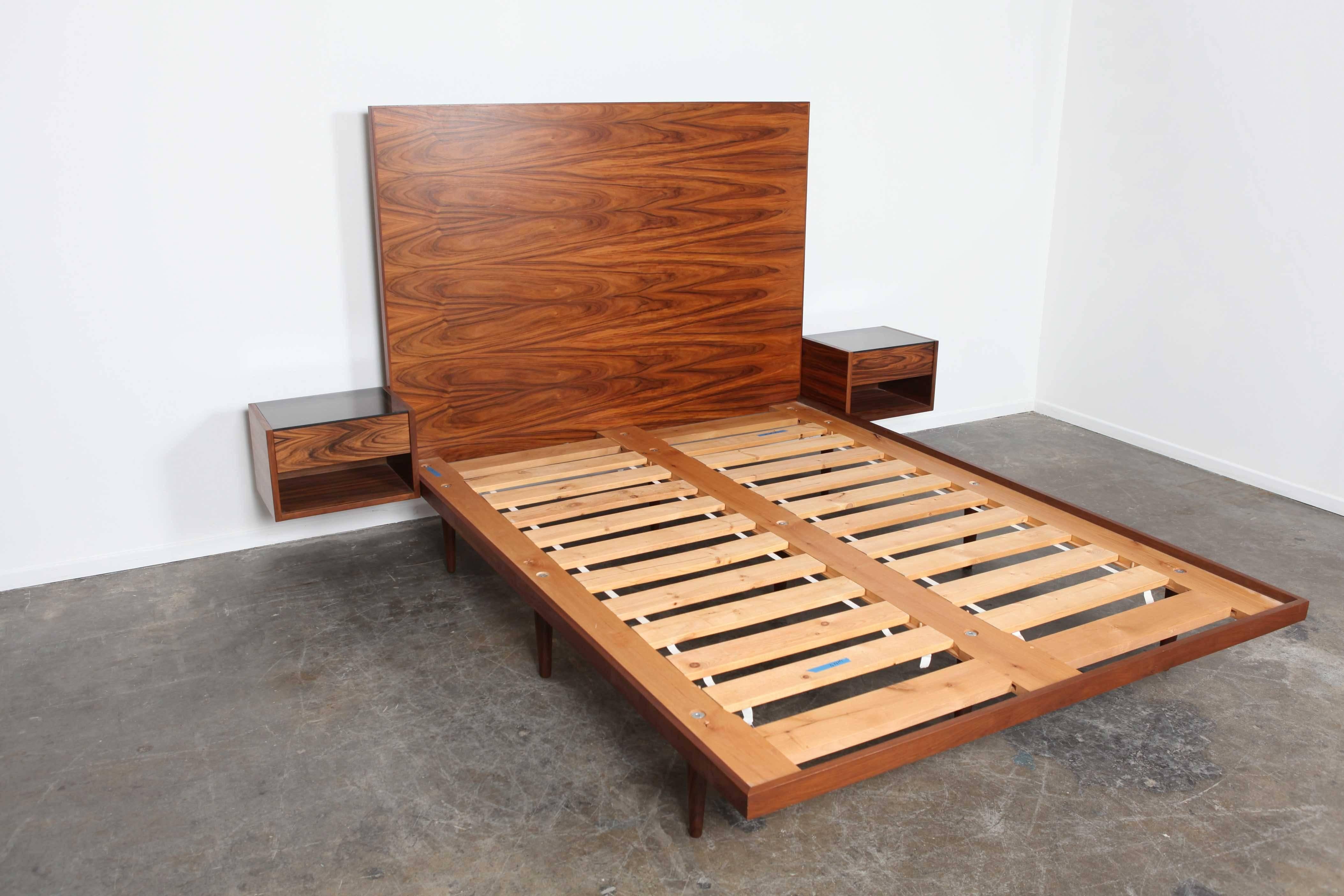 Newly produced queen-size bed with floating bedside tables that have a single drawer. Headboard and tables are made from Santos Rosewood . while the frame is solid walnut with ash platform. Dimensions: bedside tables 16.75