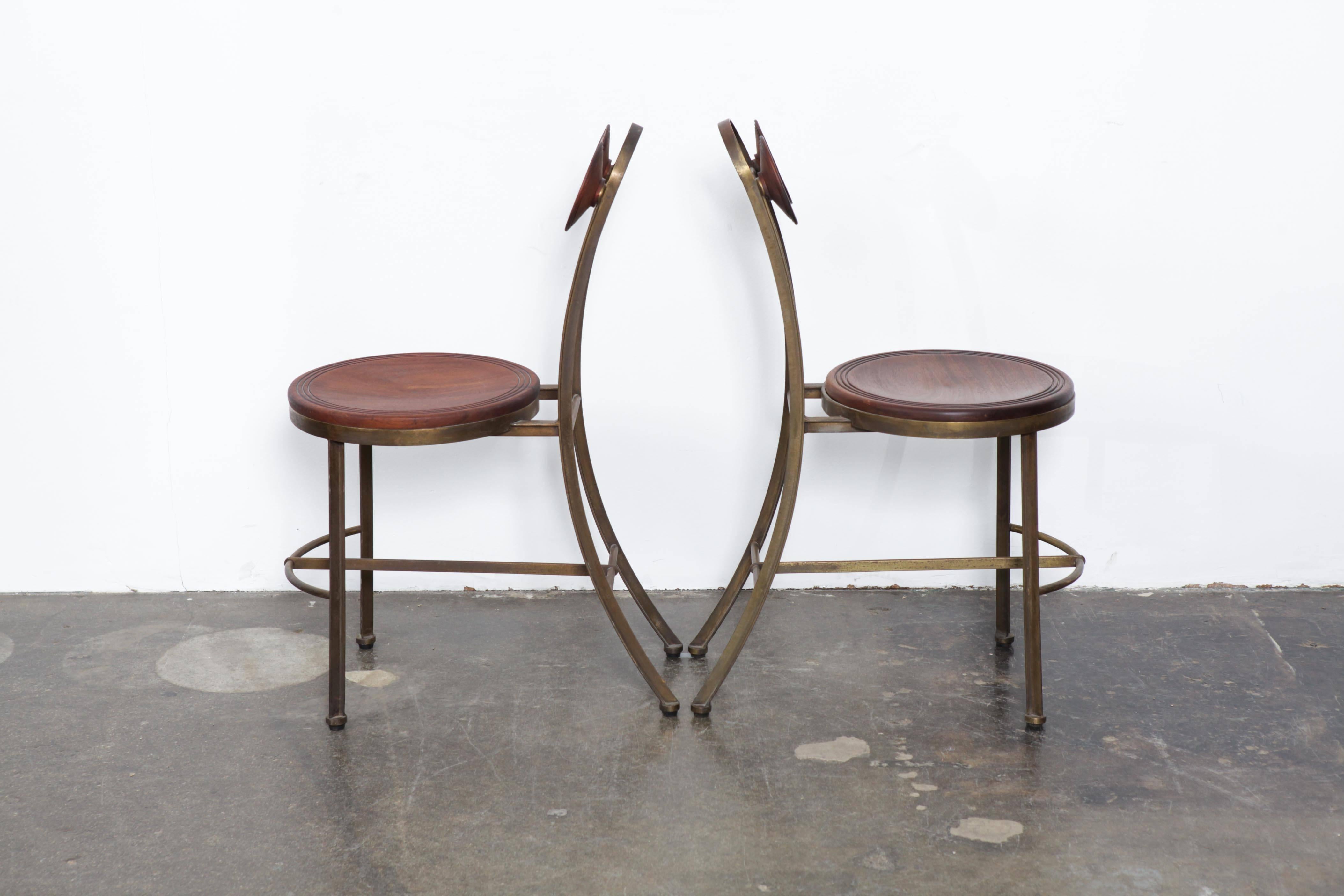 Very unique pair of solid bronze and freijo wood chairs by Pedro Useche, Brazil, 1960s. The solid wood seat and matching solid wood circular backs are finished in a natural oil finish.