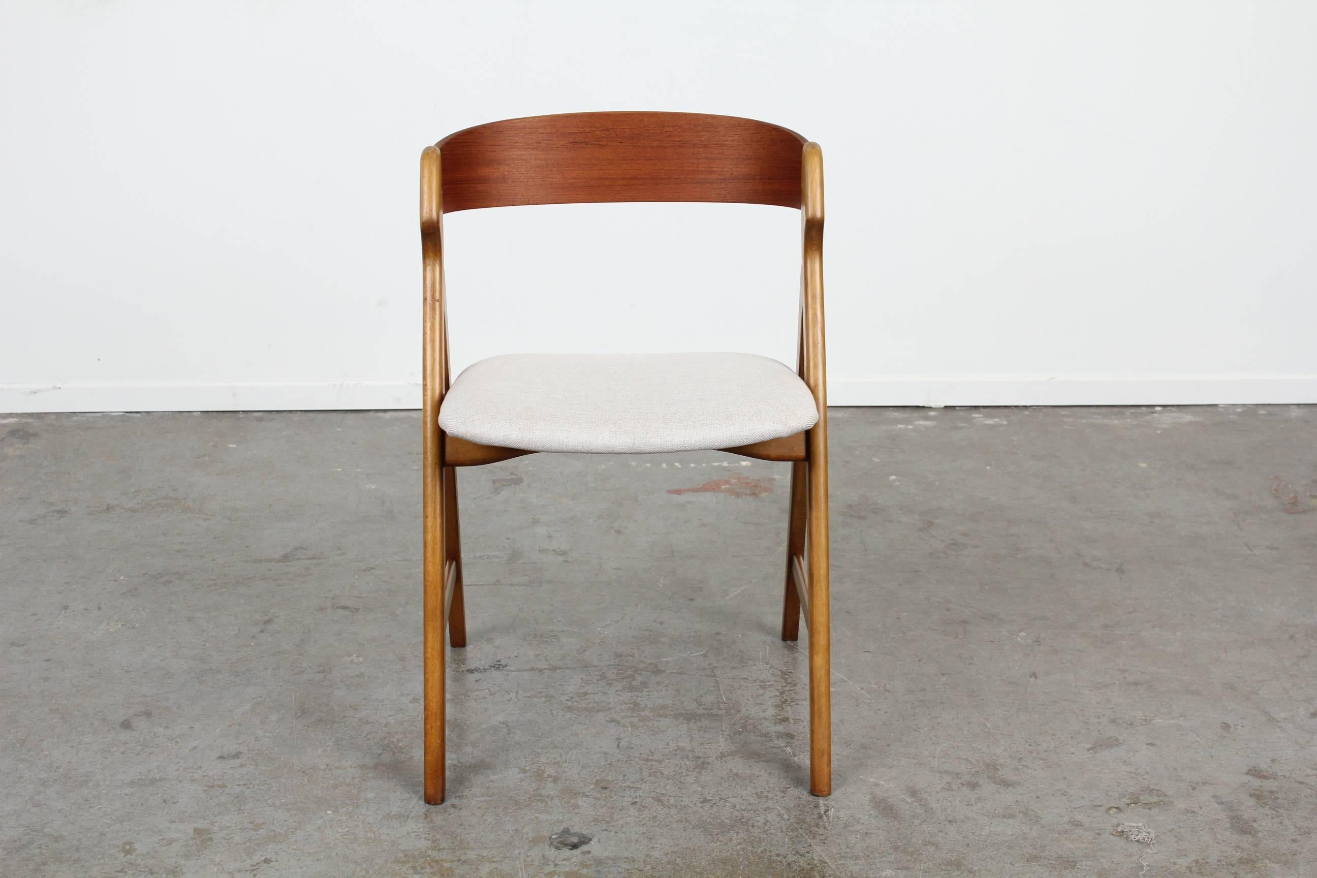 Set of 4 Mid Century Danish Modern Teak Dining Chairs by Henning Kjaernulf, newly upholstered and refinished.