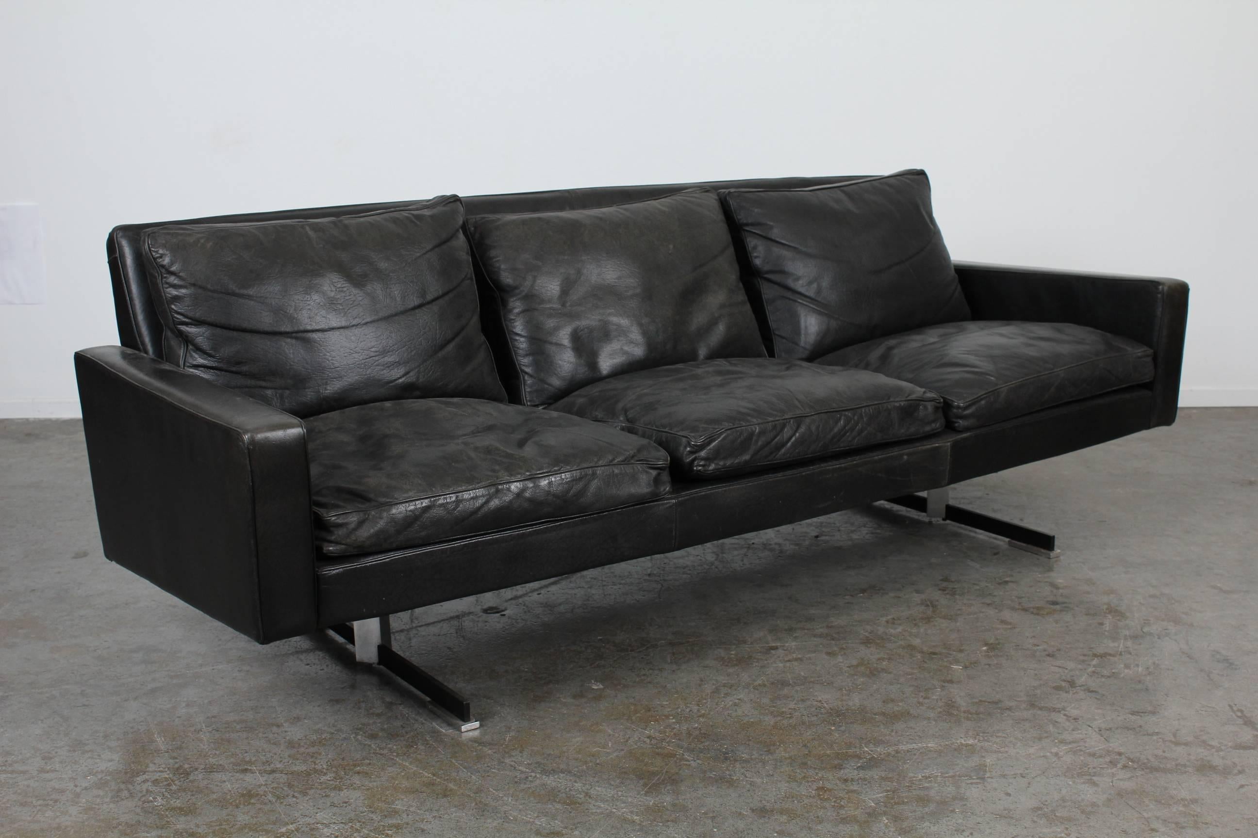 Mid Century Modern Sofa, with original black leather and chrome legs