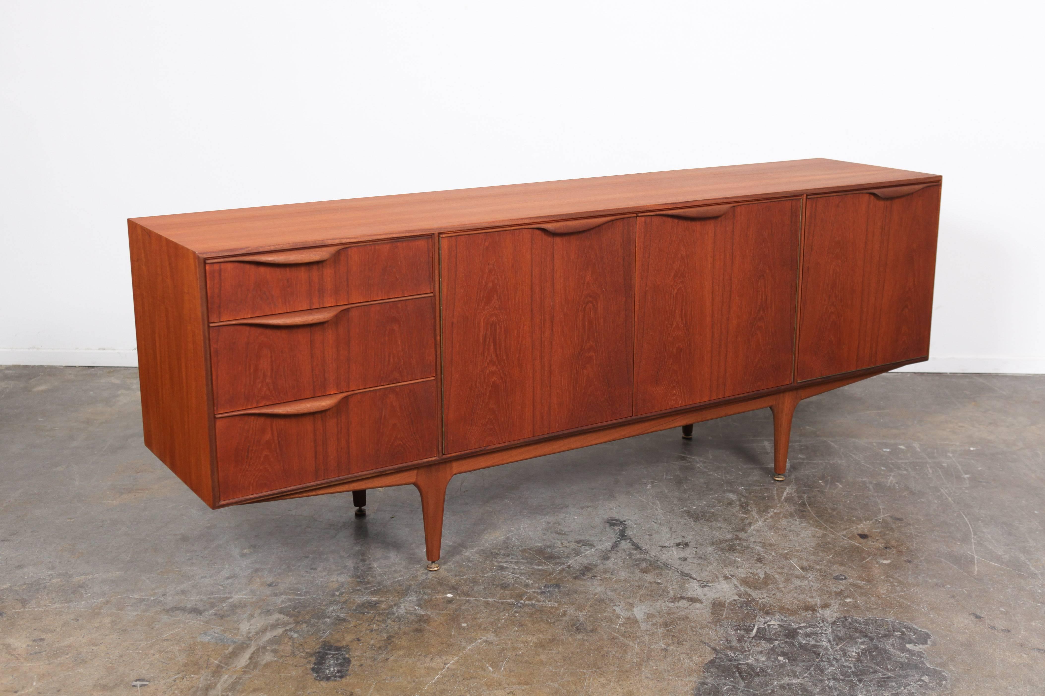 Teak Mid-Century Modern three-door, three-drawer low sideboard by A.H. McIntosh of Scotland, part of the Dunvegan series.