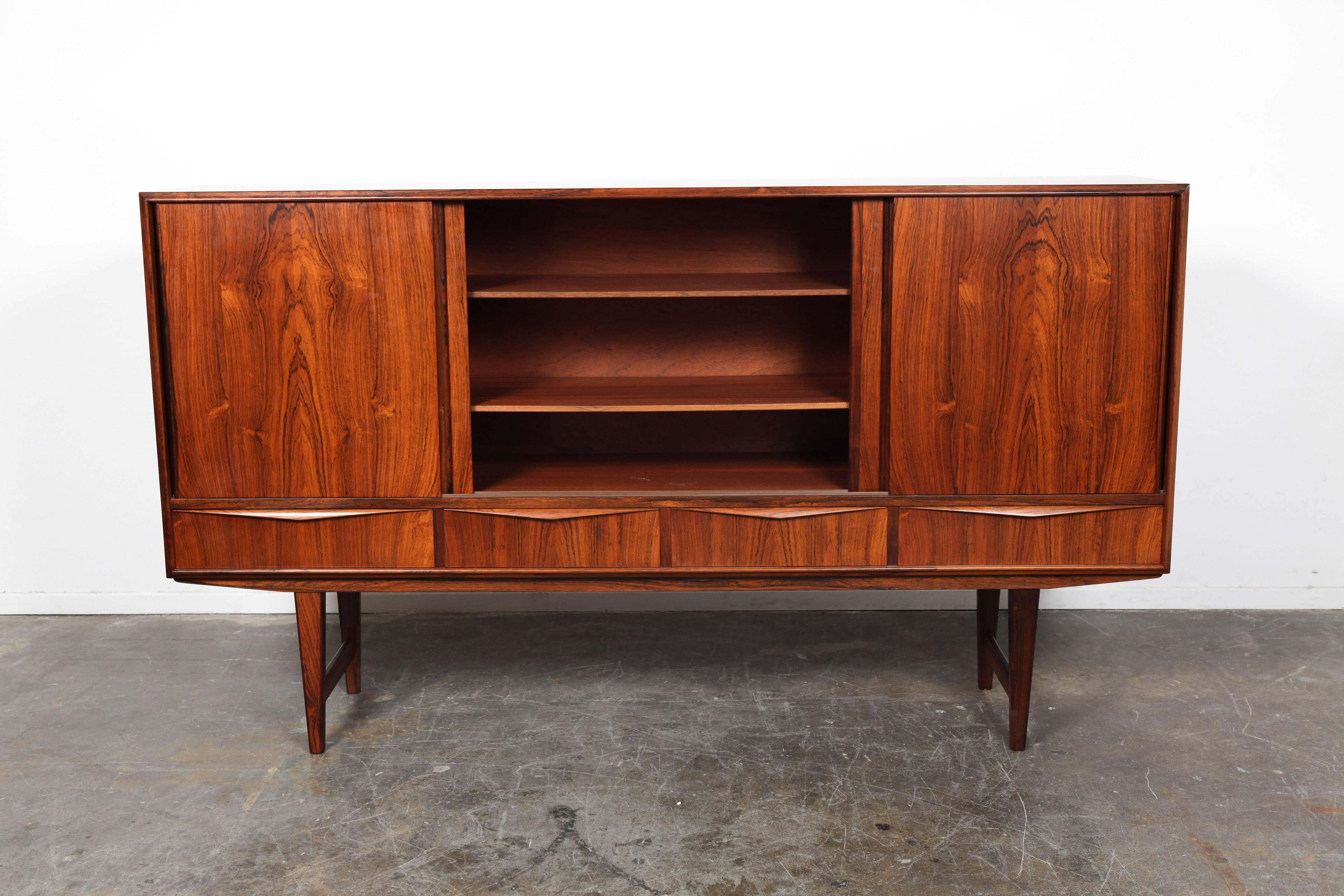 Danish Mid-Century Modern rosewood credenza designed by E.W. Bach. The right cabinet features a frosted patterned mirror with two drawers and detailed marquetry.