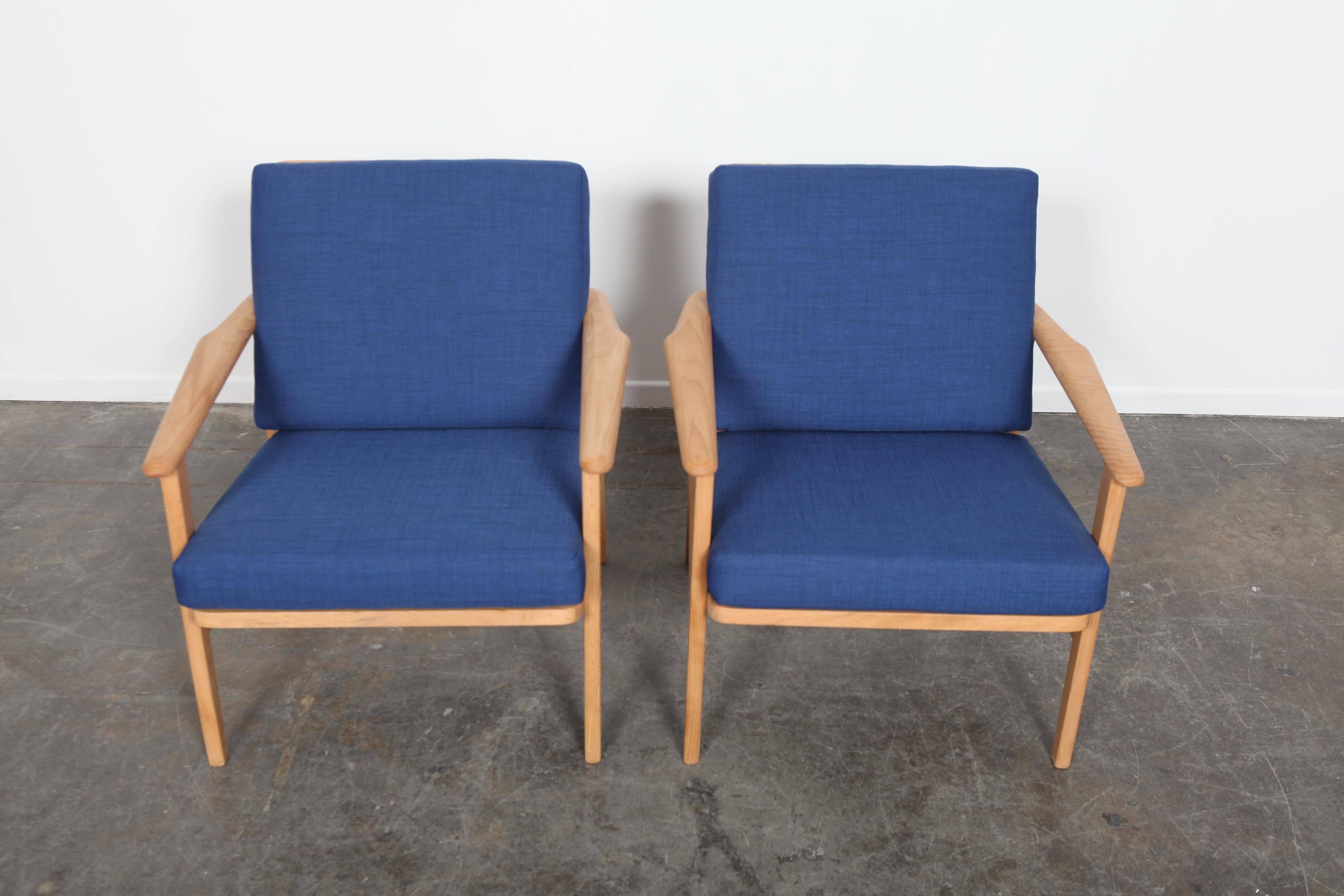 Pair of Classic Mid-Century Modern low back all wood lounge chairs. Newly refinished and reupholstered.