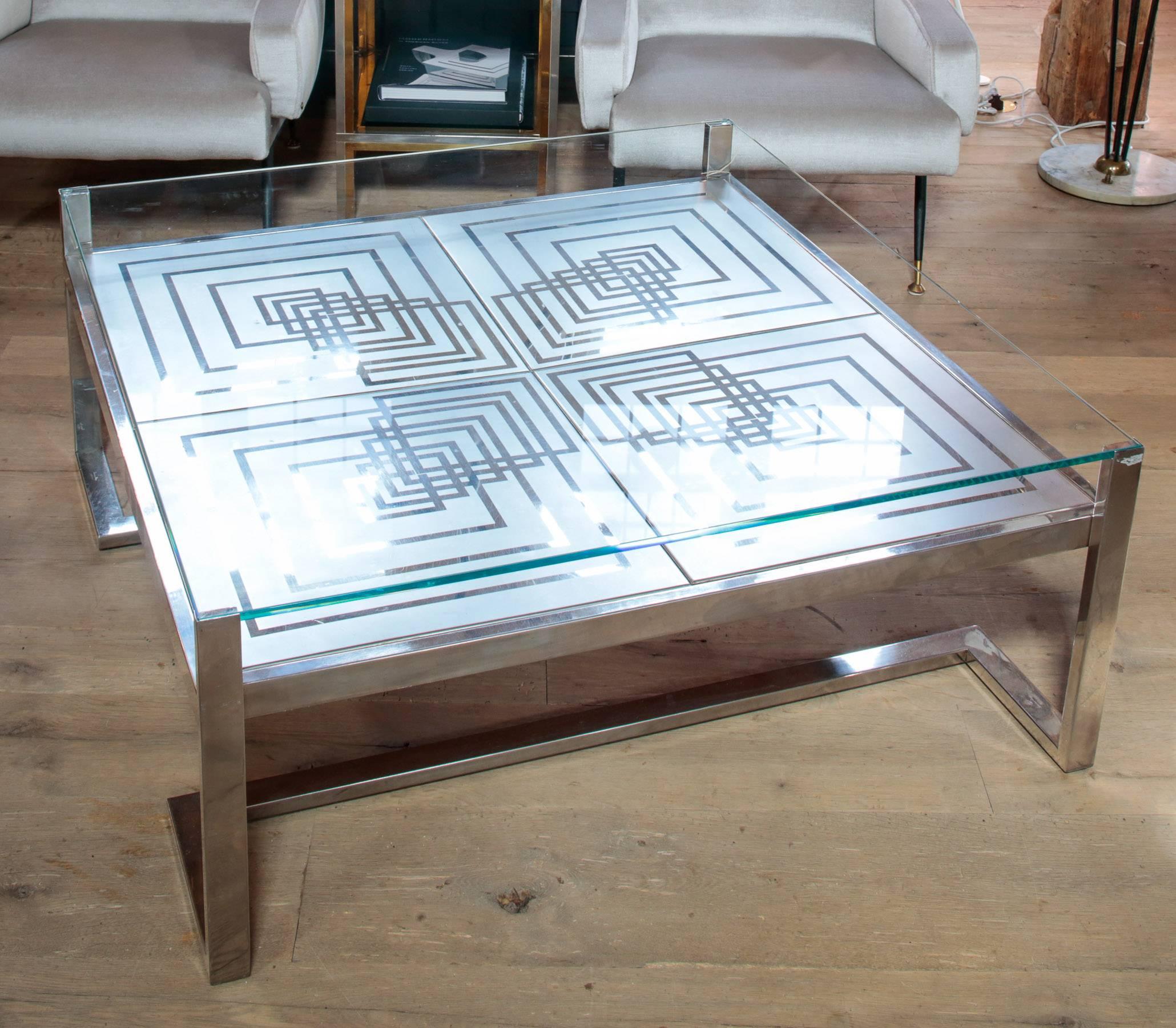 Beautiful 1970s Romeo Rega coffee table in stainless steel and glass with beautiful etching. Designer's insignia in the corner.