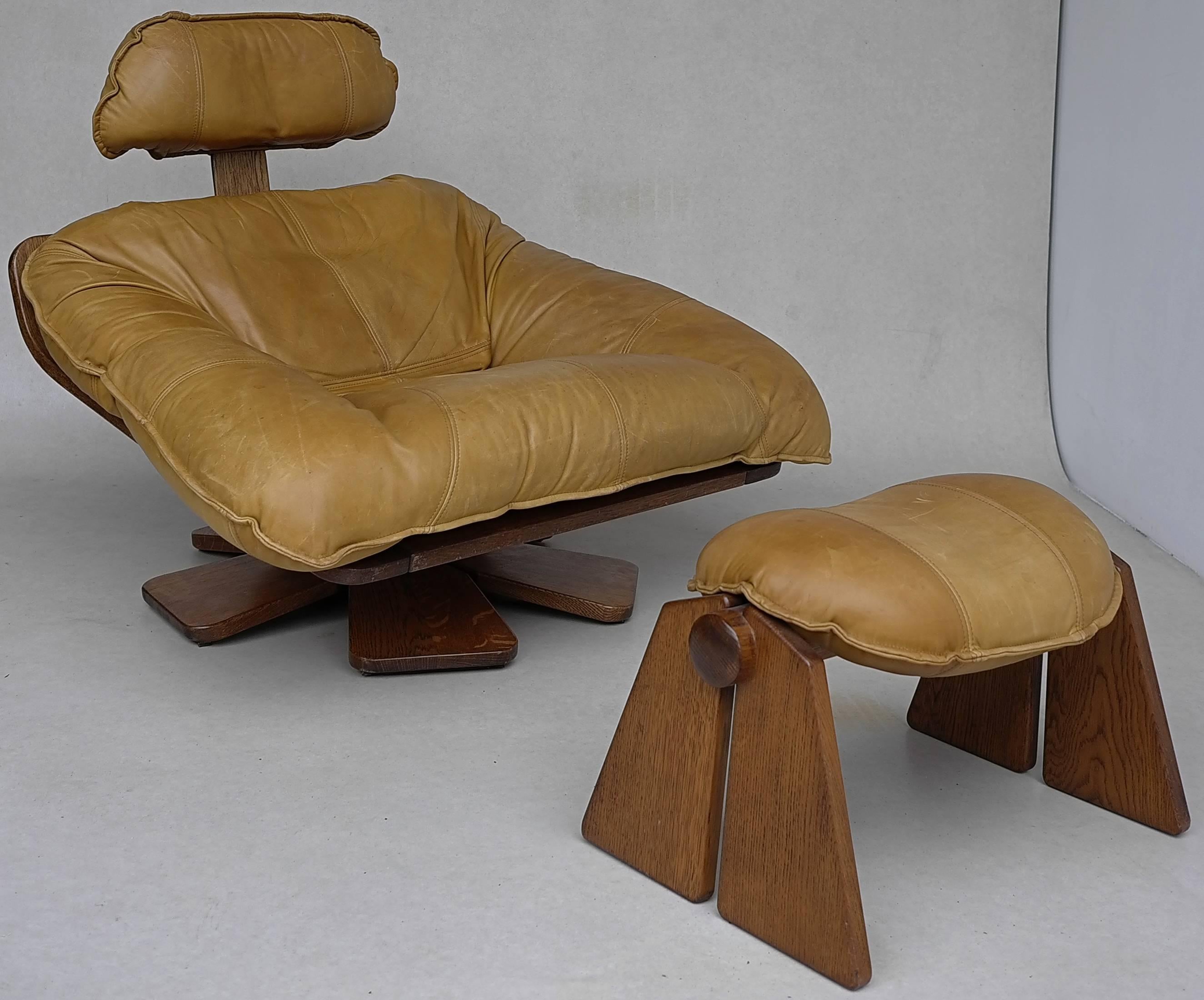 Cognac leather lounge chair with ottoman, Brazil, 1960s.
The lounge chair is rotatable and made from a high quality cognac leather.
The base is in solid wood.
