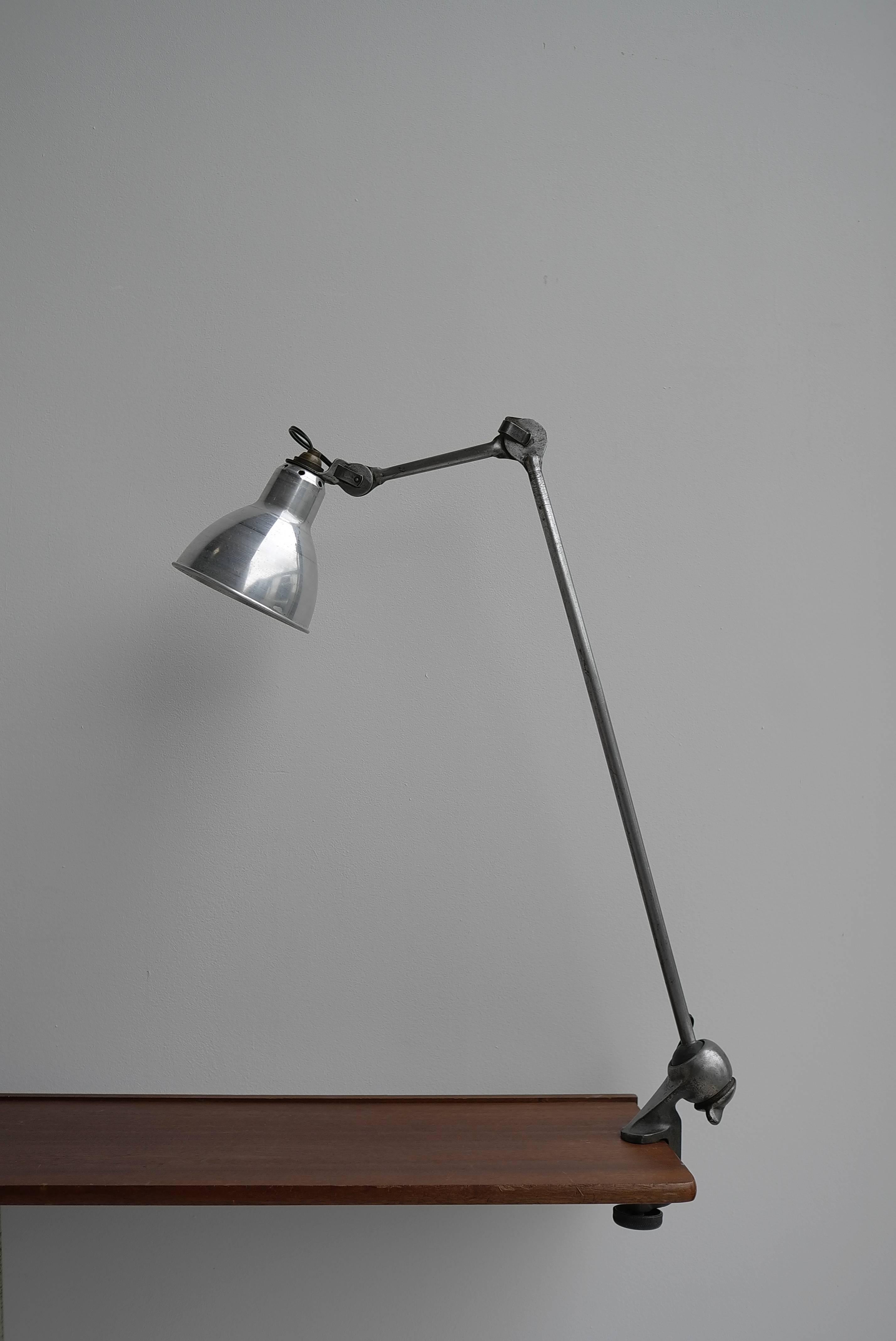 Lampe Gras No. 201 Table Lamp, France circa 1930 

This Table Lamp is designed by Bernard-Albin Gras.
Manuactured by Gras (France) around 1930.
Aluminium and steel.

In 1922 Bernard-Albin Gras designed a series of lamps for use in offices and