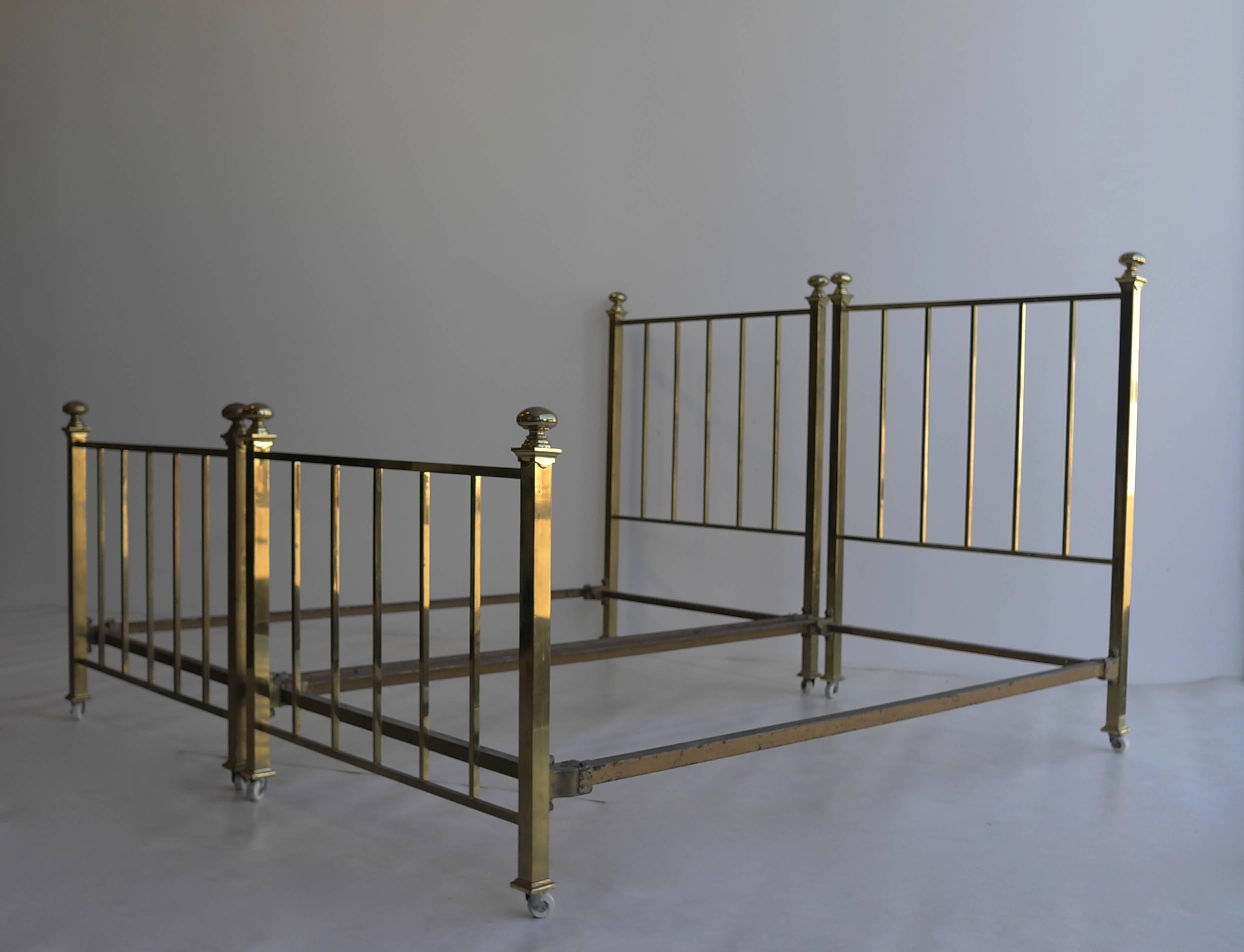 Pair of early 20th century brass beds.

Each bed is: 102 cm wide (mattress size 99 x 190), height headboard 131cm, height footboard 87cm.

Brass headboard and footboard they come with the original middle section.
The length can be easy