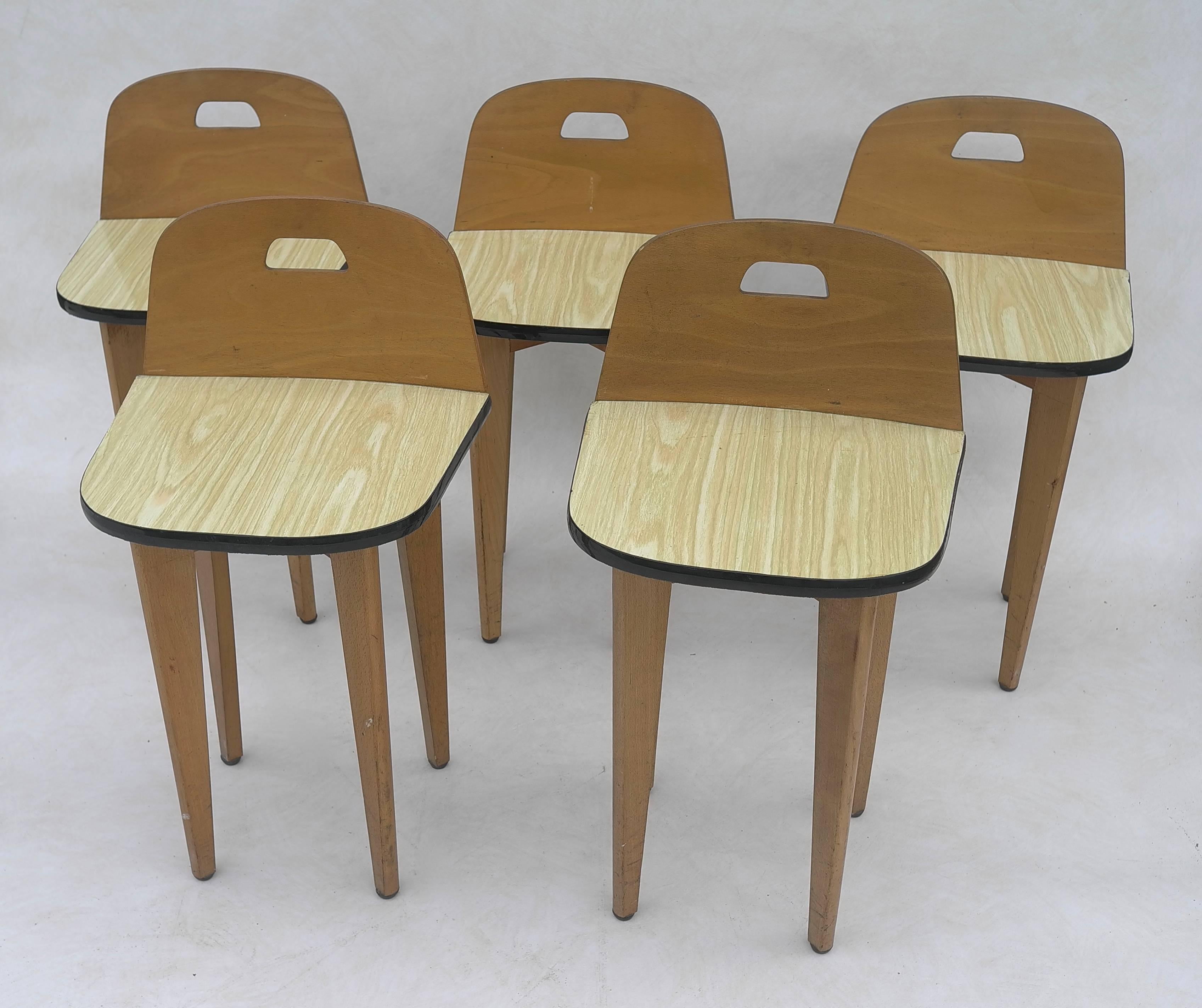 Five birchwood stools with Formica seat, France, 1950s.