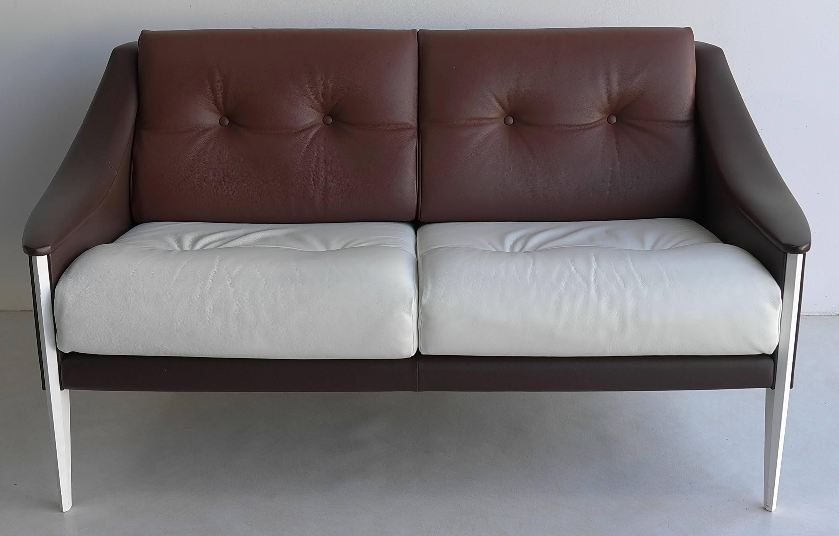 Gio Ponti Dezza sofa designed by Gio Ponti and produced by Poltrona Frau.
In different leather, brown and white tones with white wooden frame.