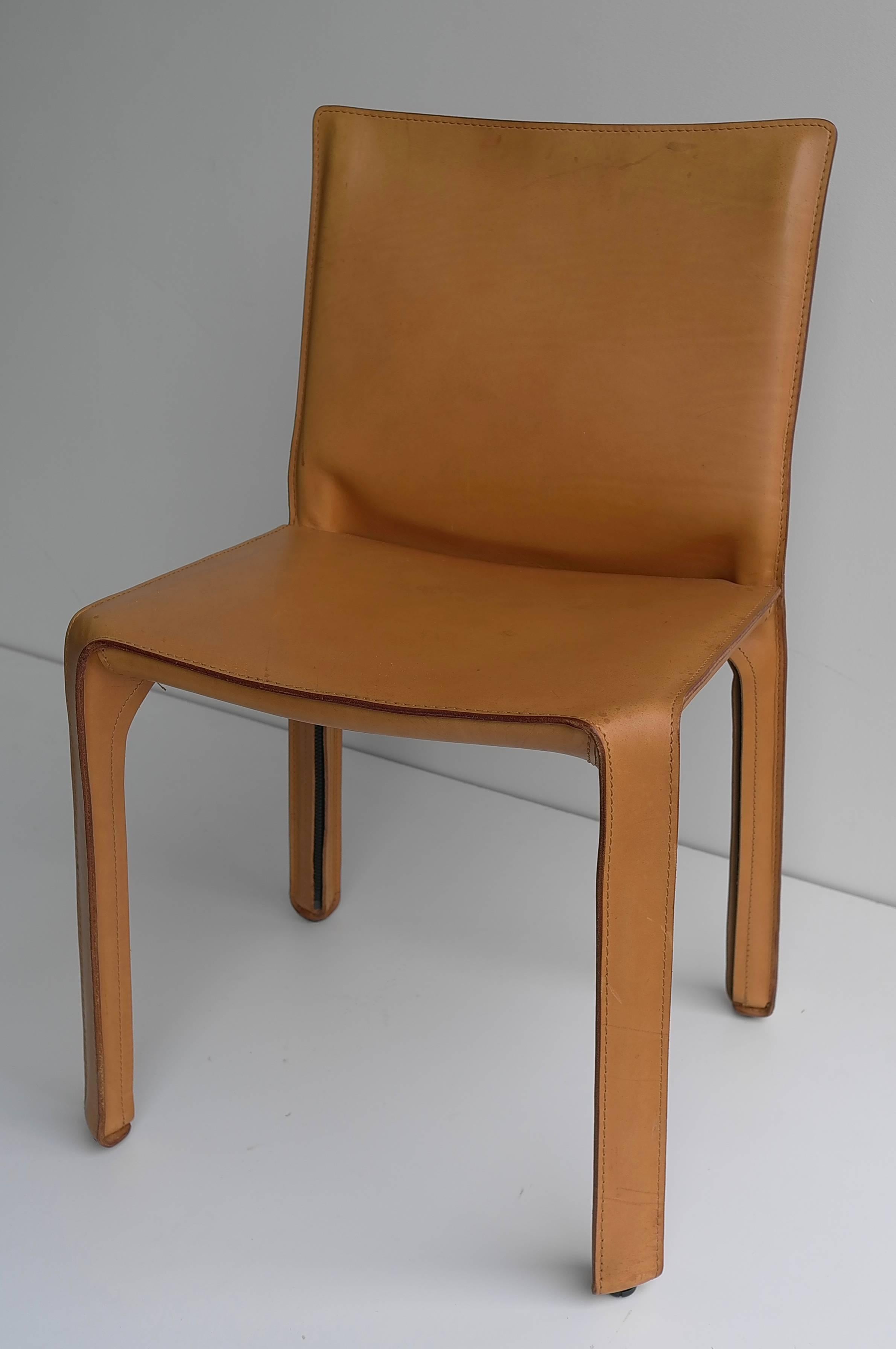 Cassina cab chair in cognac leather.

Chair with enamelled steel frame. The seat is padded with polyurethane foam. Leather upholstery zippered over the frame, in cognac leather.
