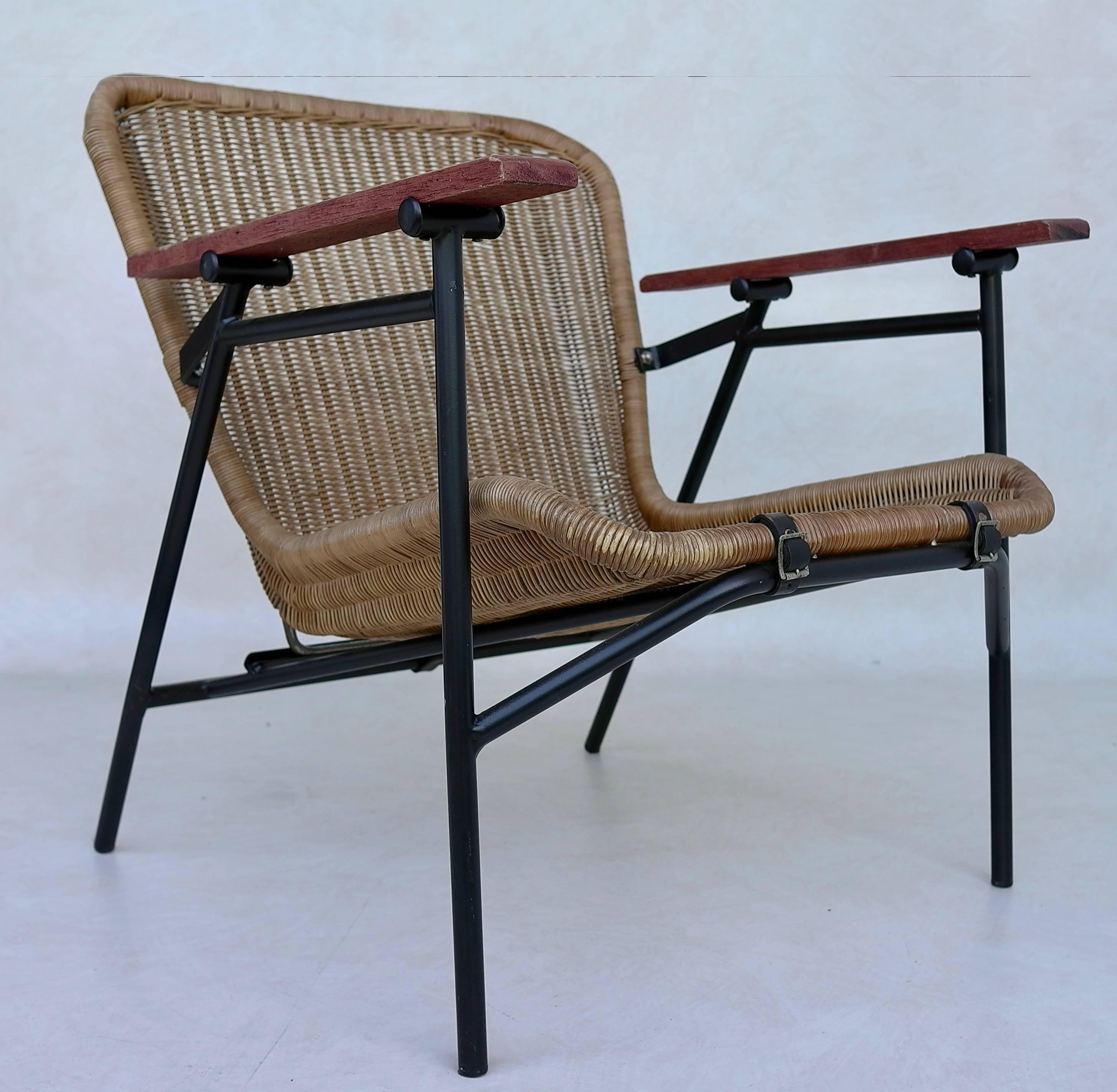 Rare dirk van Sliedregt armchair in Rattan and steel secured with three black leather straps.