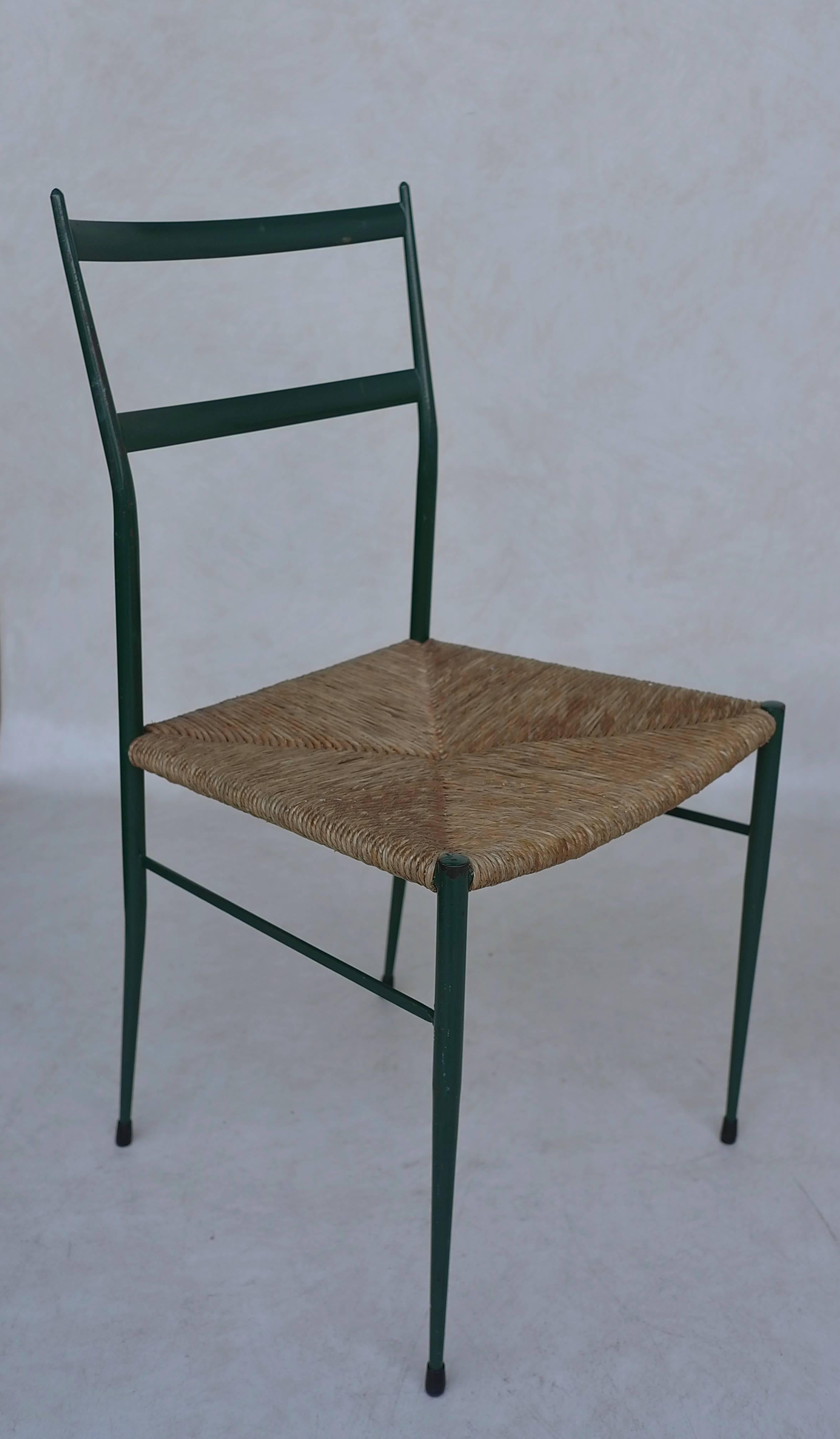 A unique set of green/turquoise metal leggera chairs with cane seats attributed to Gio Ponti.
These chairs where sold in the famous Dutch warehouse ''De Bijenkorf.'' 
Gio Ponti totally redesigned the Bijenkorf in Eindhoven in 1969.
  