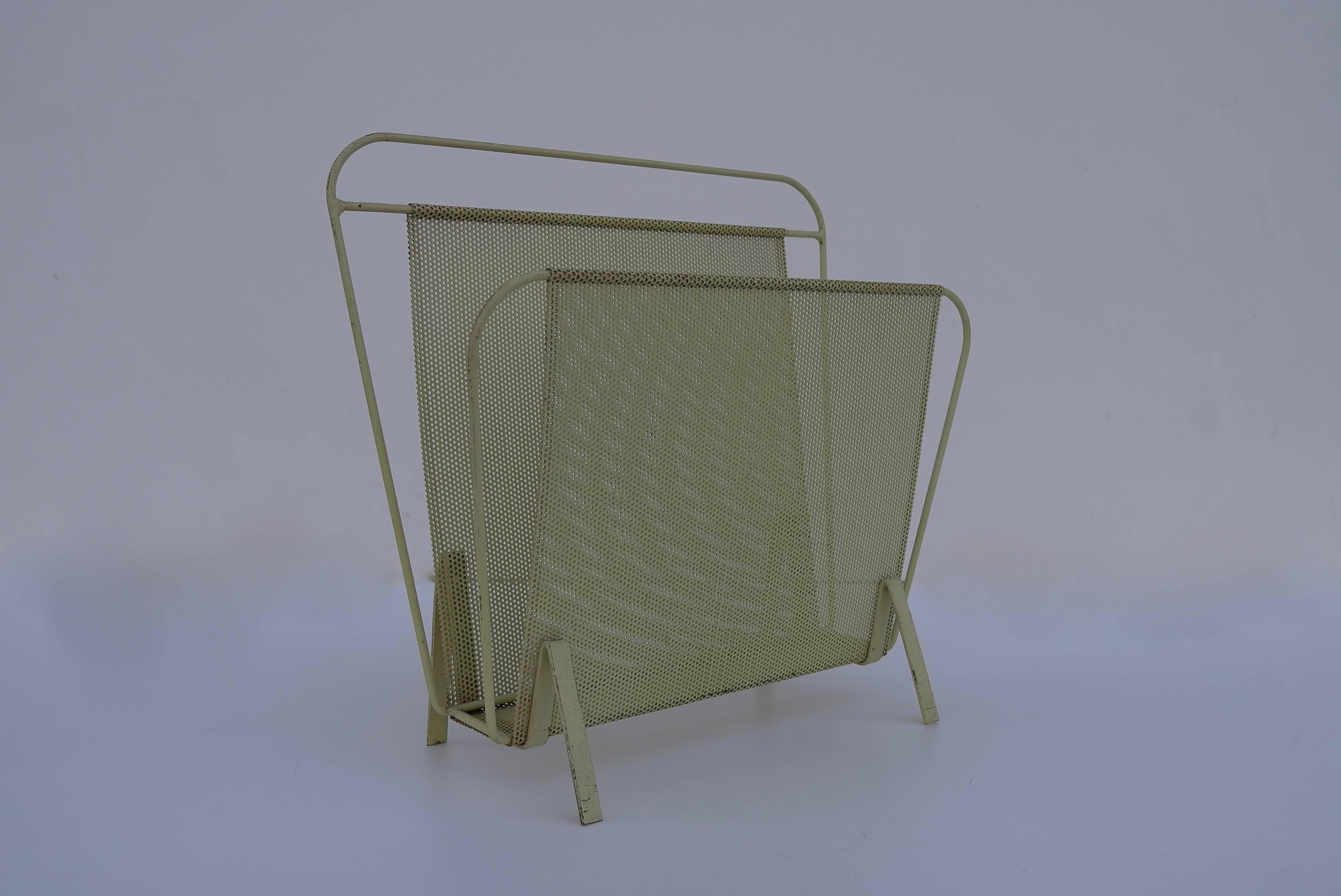 Magazine holder, model Harpers, designed by Mathieu Matégot and florid fiedeldij in rare yellow. Manufactured by Artimeta (Netherlands,) circa 1950. Folded, perforated metal. Designed in collaboration with Floris H. Fiedeldij together with Mathieu