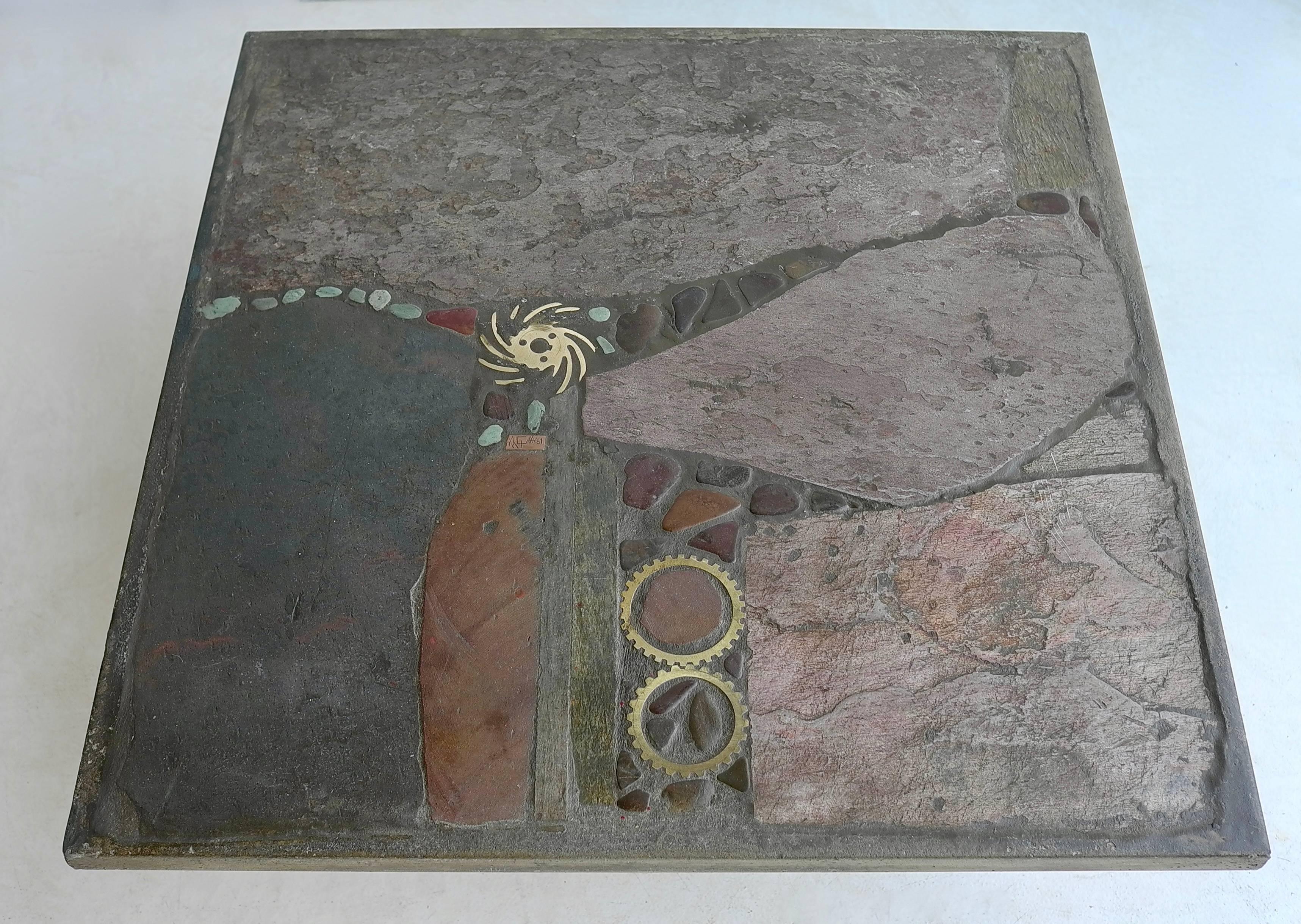 Paul Kingma slate stone and brass art table. This is a one off unique early piece made of anthracite, green en red, brown and turquoise stone and brass details, Signed by the artist in brass Paul Kingma 1981.
