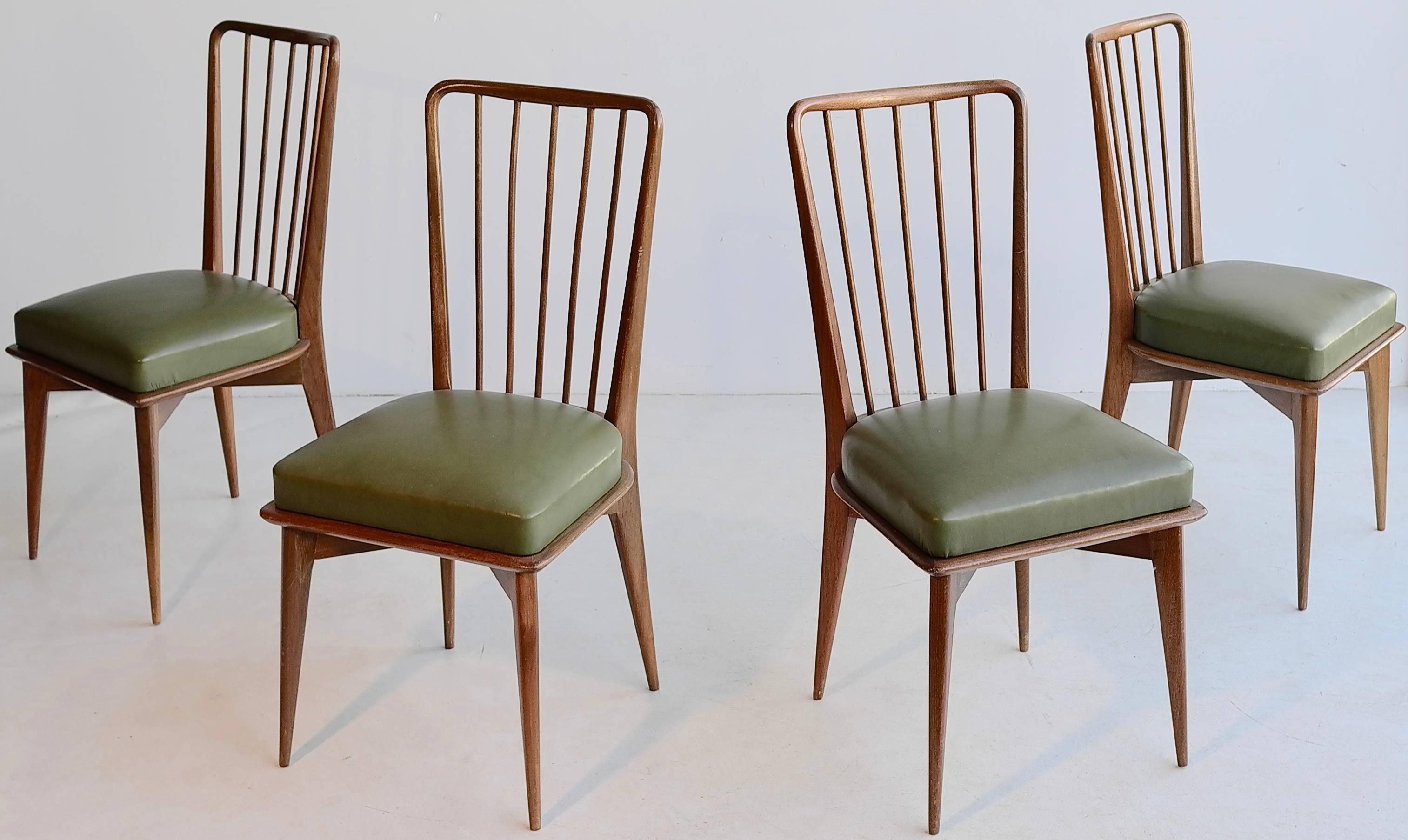 Set of four Paolo Buffa wooden dining chairs with the original green seats.
